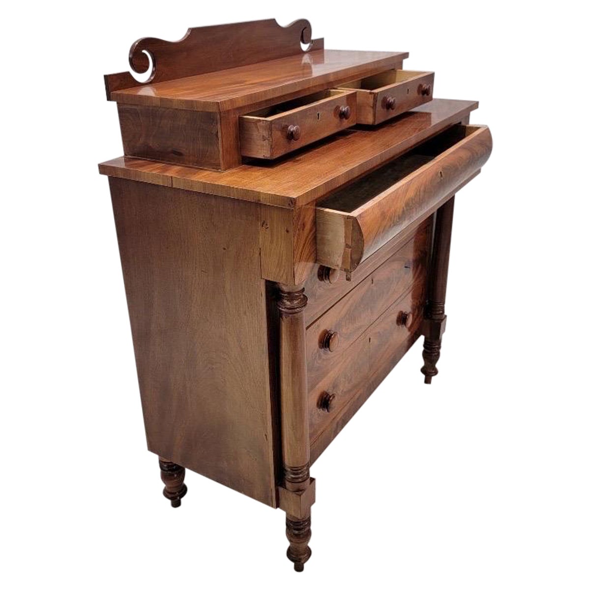 Antique American Empire Flame Mahogany Step Back Chest of Drawers

This Antique Empire style cabinet has ample storage and display space. This piece would be great for a bedroom to store clothes and display accessories.

Dimensions 
H 49