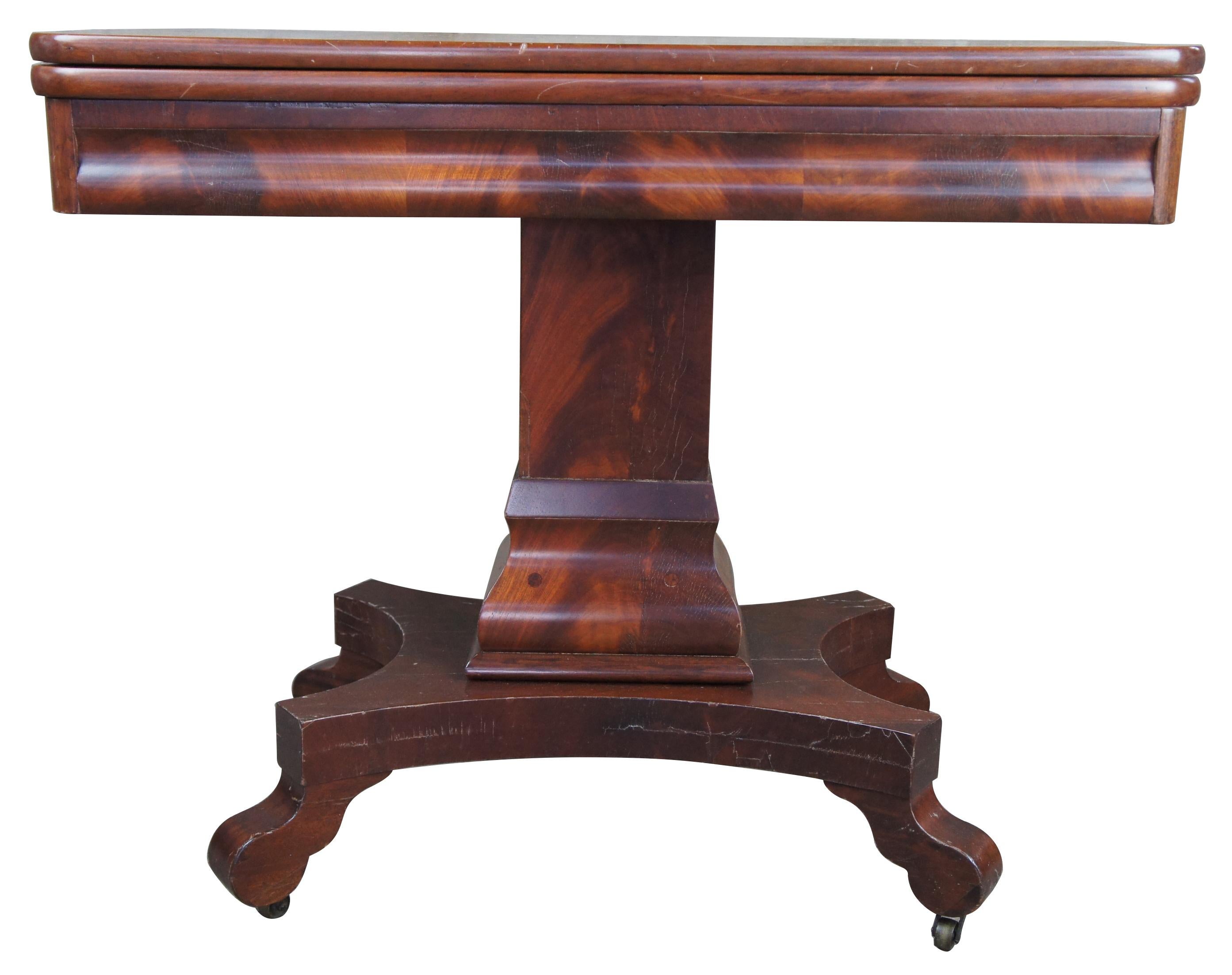 Antique American Empire flame mahogany swivel console game table card entryway

Exceptional flame mahogany game table, circa 1850s. Features a solid mahogany swivel flip top with compartment beneath for storage.