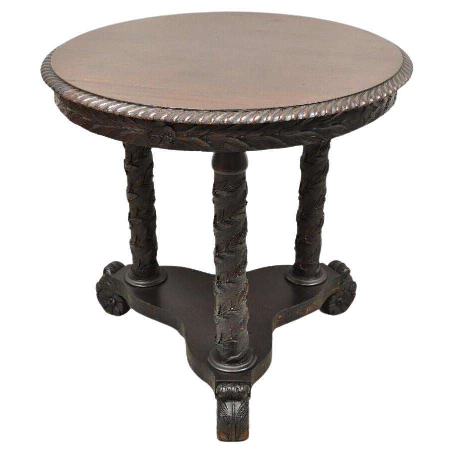 Ancienne table de bibliothèque ronde en acajou sculpté de motifs floraux en spirale Empire Antiques en vente