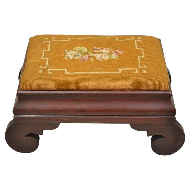 https://a.1stdibscdn.com/antique-american-empire-mahogany-brown-floral-needlepoint-footstool-ottoman-for-sale/f_9341/f_373151221701285352524/f_37315122_1701285352896_bg_processed.jpg?width=768