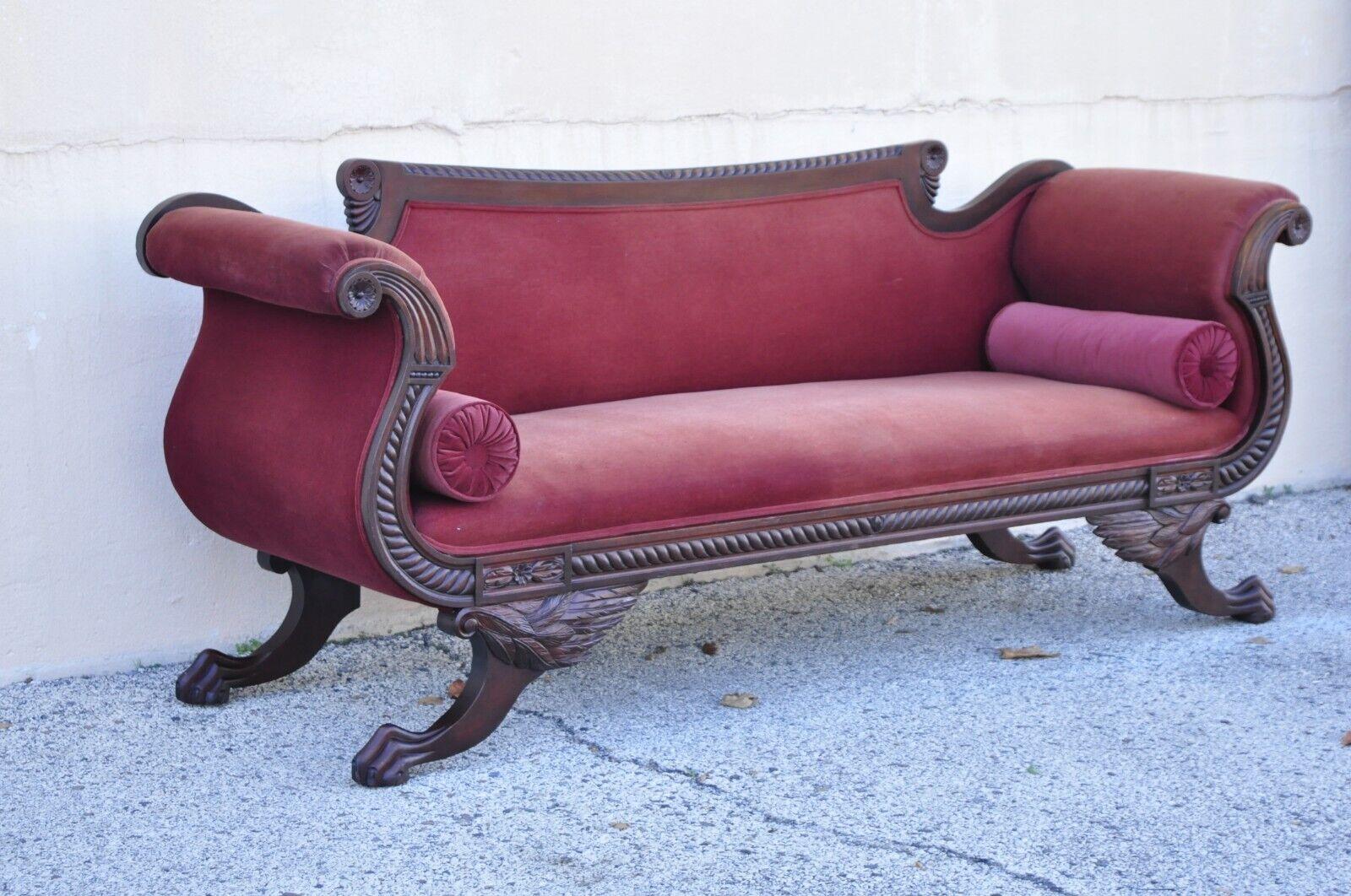 Antique American Empire Mahogany Frame Carved Paw Feet Scroll arm sofa. Item features scrolling carved arms, ornate paw feet, red mohair fabric, very nice vintage item, great style and form. Circa 19th Century. Measurements: 35