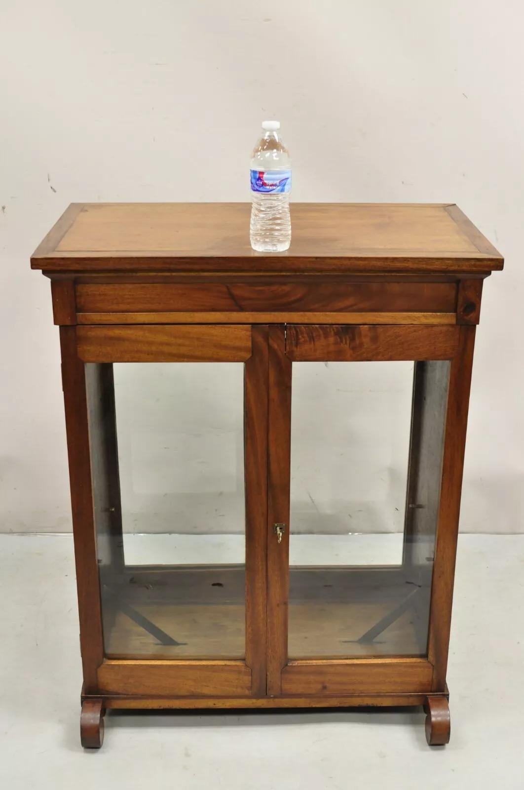 Antique American Empire Mahogany Glass Double Sided Entry Curio Display Cabinet Curio. Includes working locks and key.  Circa Late 19th Century. Measurements: 36.5
