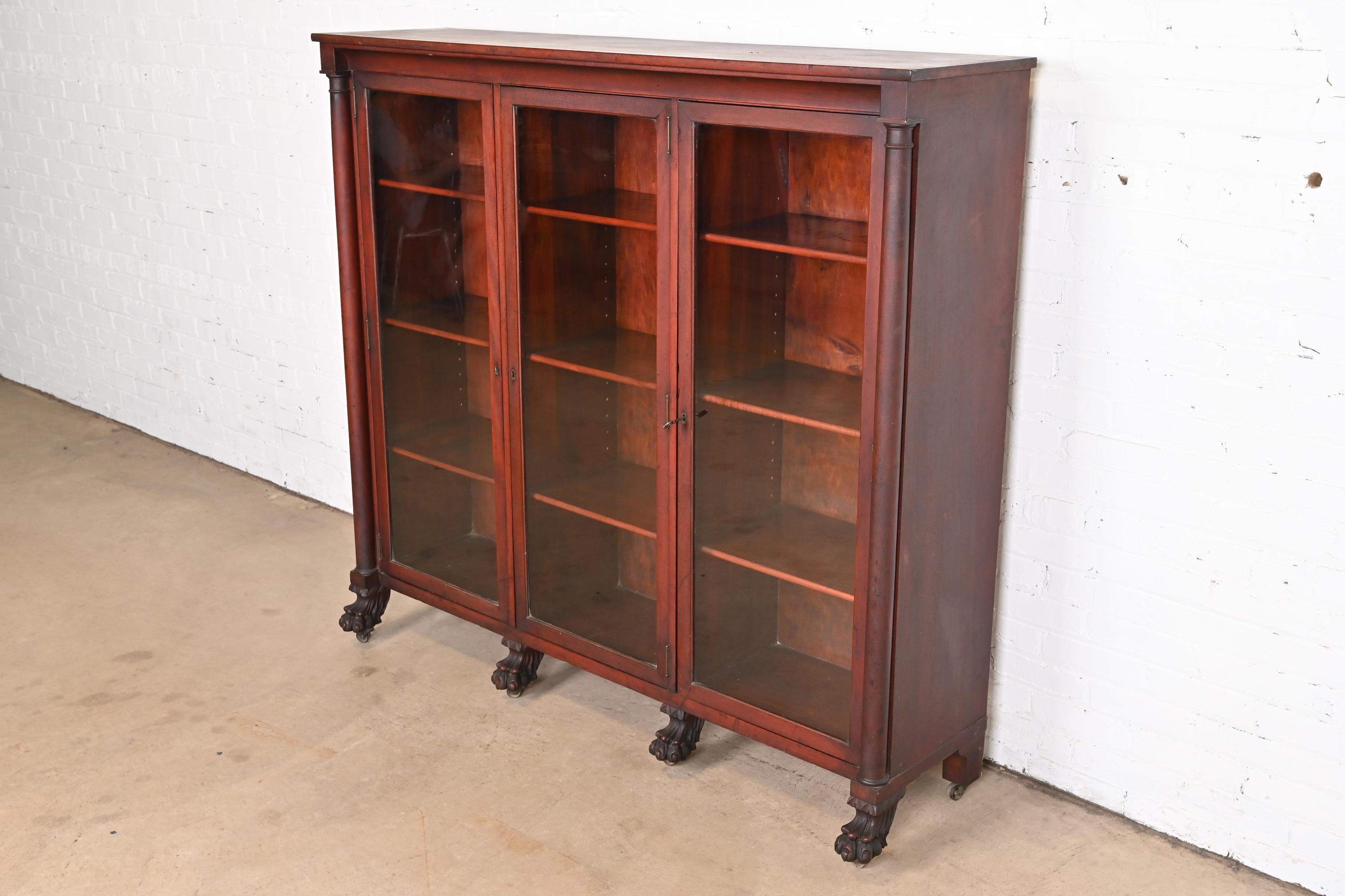 Antique American Empire Mahogany Triple Bookcase with Carved Lion Paw Feet In Good Condition In South Bend, IN