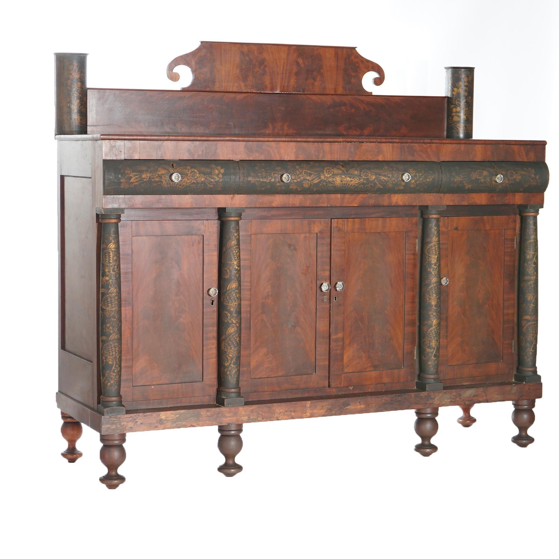 An antique Greco American Empire sideboard offers scroll form backsplash over case with single long drawer and two smaller drawers surmounting lower double door cabinet with flanking side cabinets, ebonized and gilt stenciled Doric columns