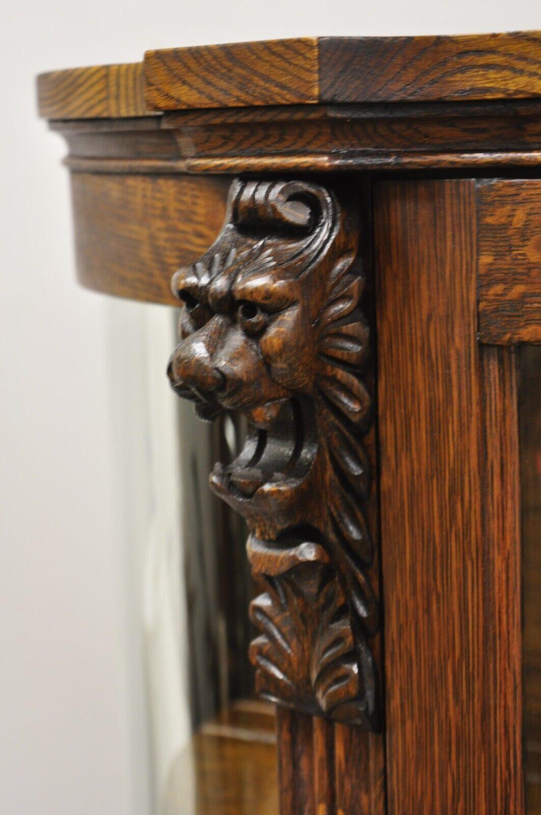 antique china cabinet with lion heads