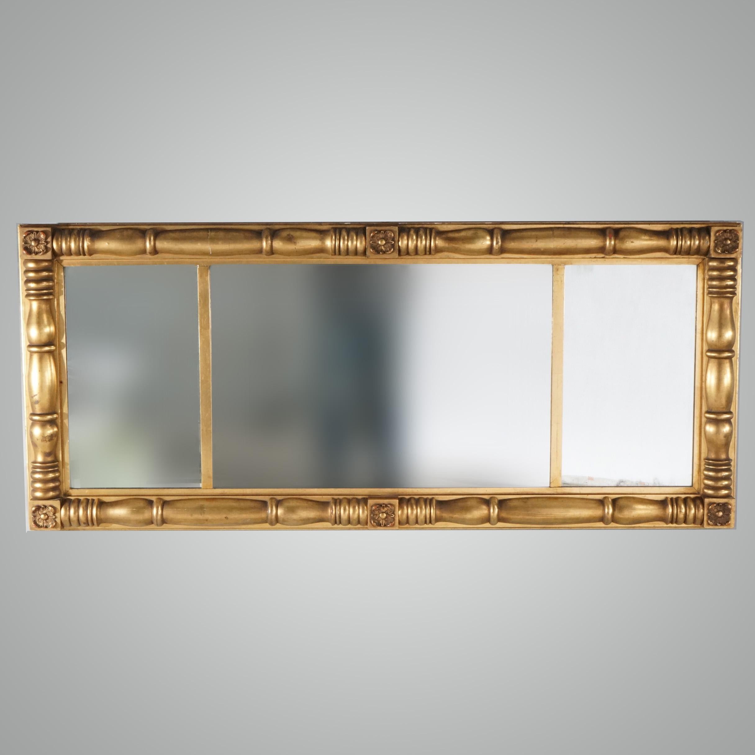 An antique American Empire wall mirror offers balustrade form giltwood frame with three-part mirror, circa 1840

Measures - 26.5