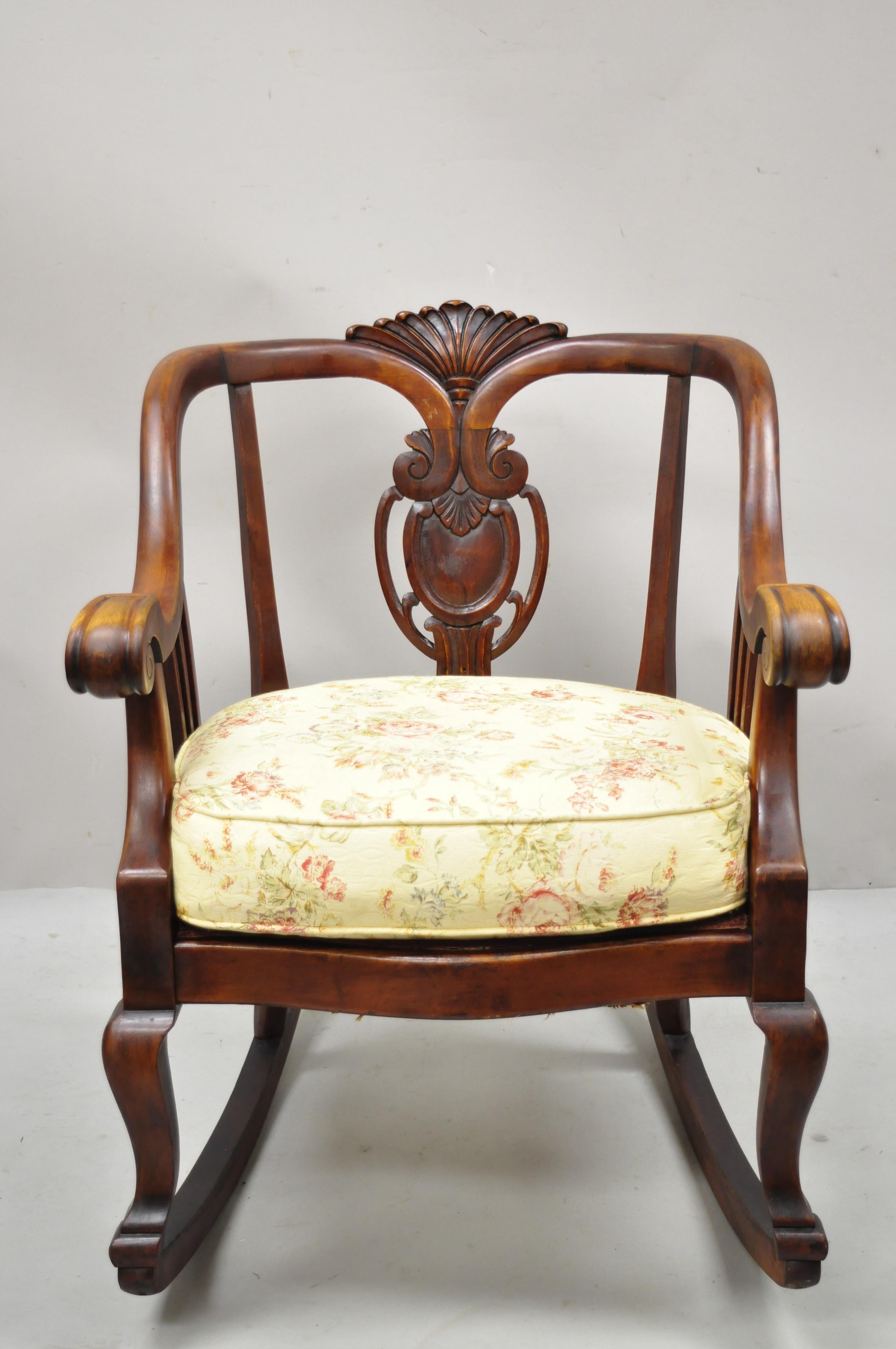 Antique American Empire Victorian solid mahogany rocker rocking chair. Item features nicely carved details, solid wood frame, beautiful wood grain, upholstered seat, very nice antique item, quality American craftsmanship, great style and form, Circa
