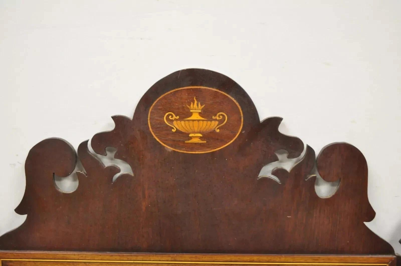 Antique American Federal Broken Arch Mahogany Mirror With Urn Inlay. Item features pencil inlay to frame, satinwood urn inlay to crest, carved mahogany frame, very nice antique item. Circa 1900. Measurements: 39.5