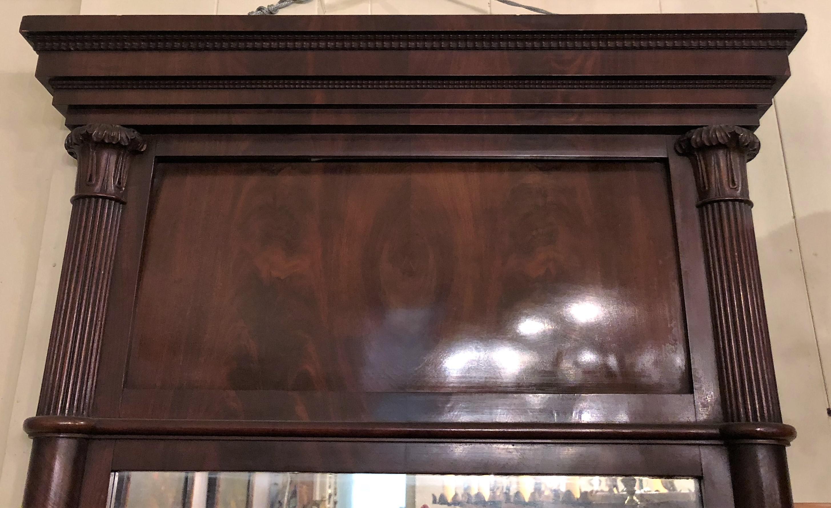 A straightforward mid-19th century American mirror. At 5 feet in height, it could work over a mantel, in an entryway or on a wall between two other pieces of furniture. For fanciers of straight lines, this is a good option.
 