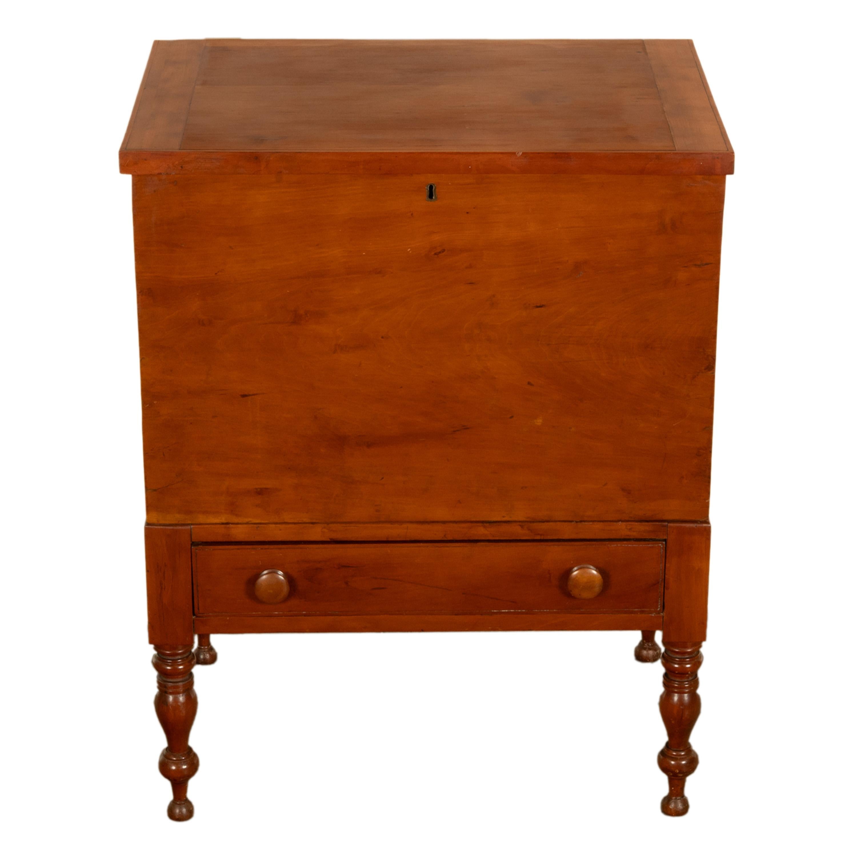 A fine & rare antique American Federal period Middle Tennessee Sheraton cherry sugar chest, circa 1820.
The chest is made from solid cheery with poplar secondary wood,  the dovetailed top case with a locking hinged top with bread board ends, the