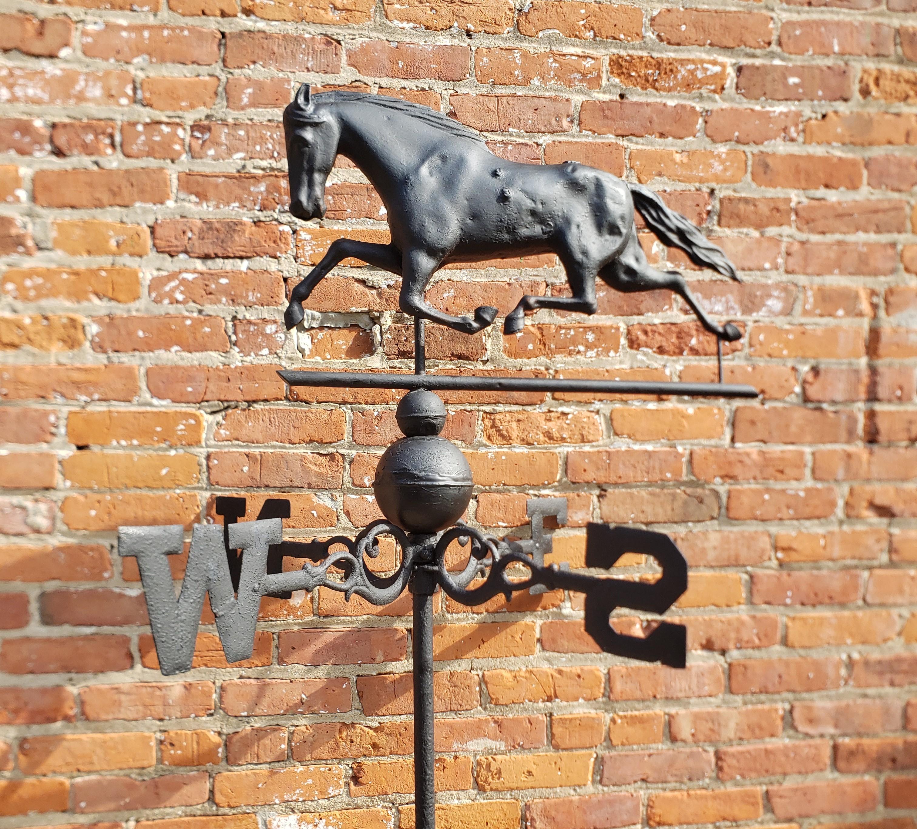 This figural antique weathervane is usigned, but presumed to have originated from the United States and date to approximately 1880 and done in the period Victorian style. The top of the weathervane is done in formed copper to depict a galloping