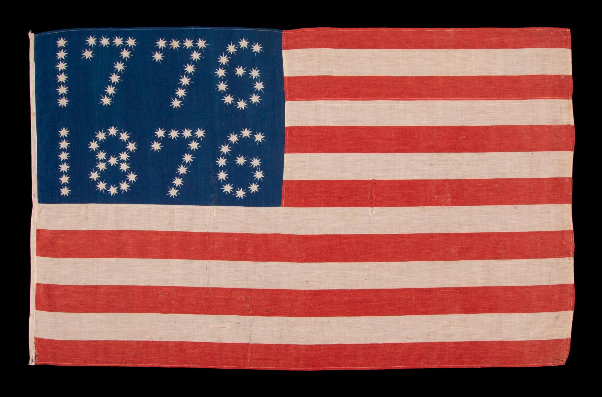 Antique American flag with 10-pointed stars that spell “1776 – 1876”, made for the 100-year anniversary of American Independence, one of the most graphic of all early examples:

Many fantastic star patterns were made in the patriotism that