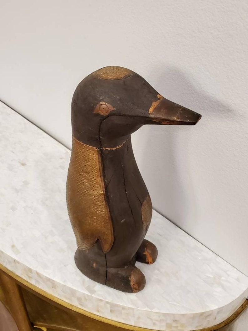 wood carved penguin