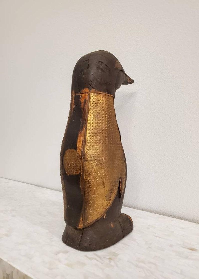 wooden penguin statue