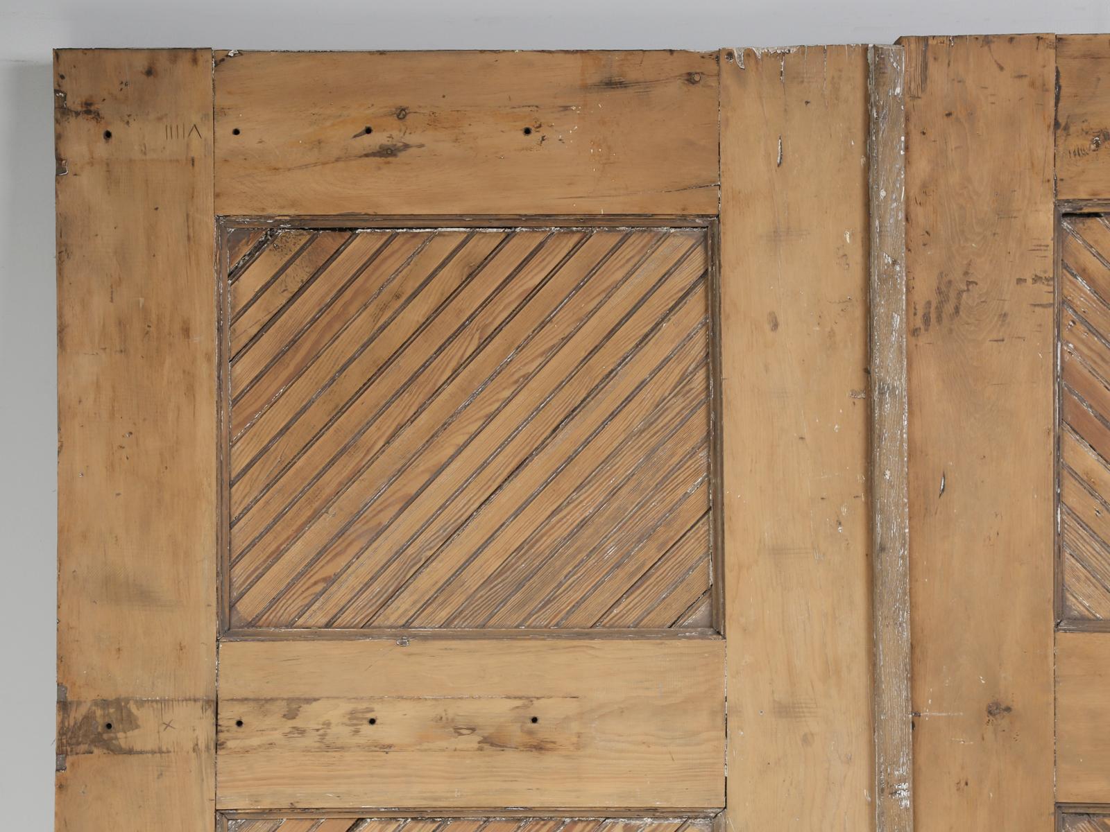 Antique American pair of barn or garage doors made from Douglas-fir. We believe that this pair of American barn or garage doors, were removed from a late 1890s home in northern Illinois. Finding old American doors in this size and condition, are