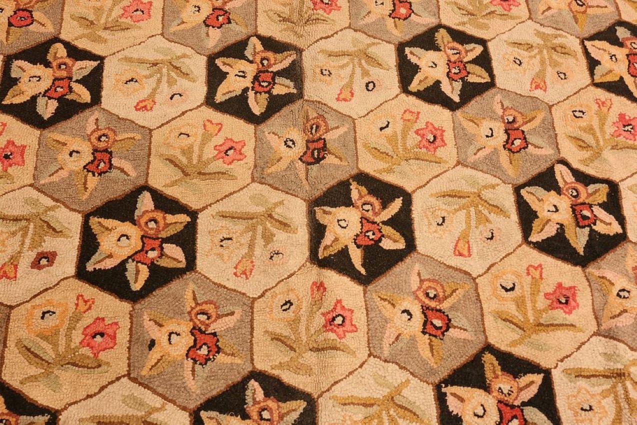 Antique American hooked room size area rug, measures: 9 ft 9 in x 7 ft 9 in (2.97 m x 2.36 m). Circa 1920's. Overall very good condition with minor stain at one end. Carpet has a very nice linen backing and it is clean and floor ready.