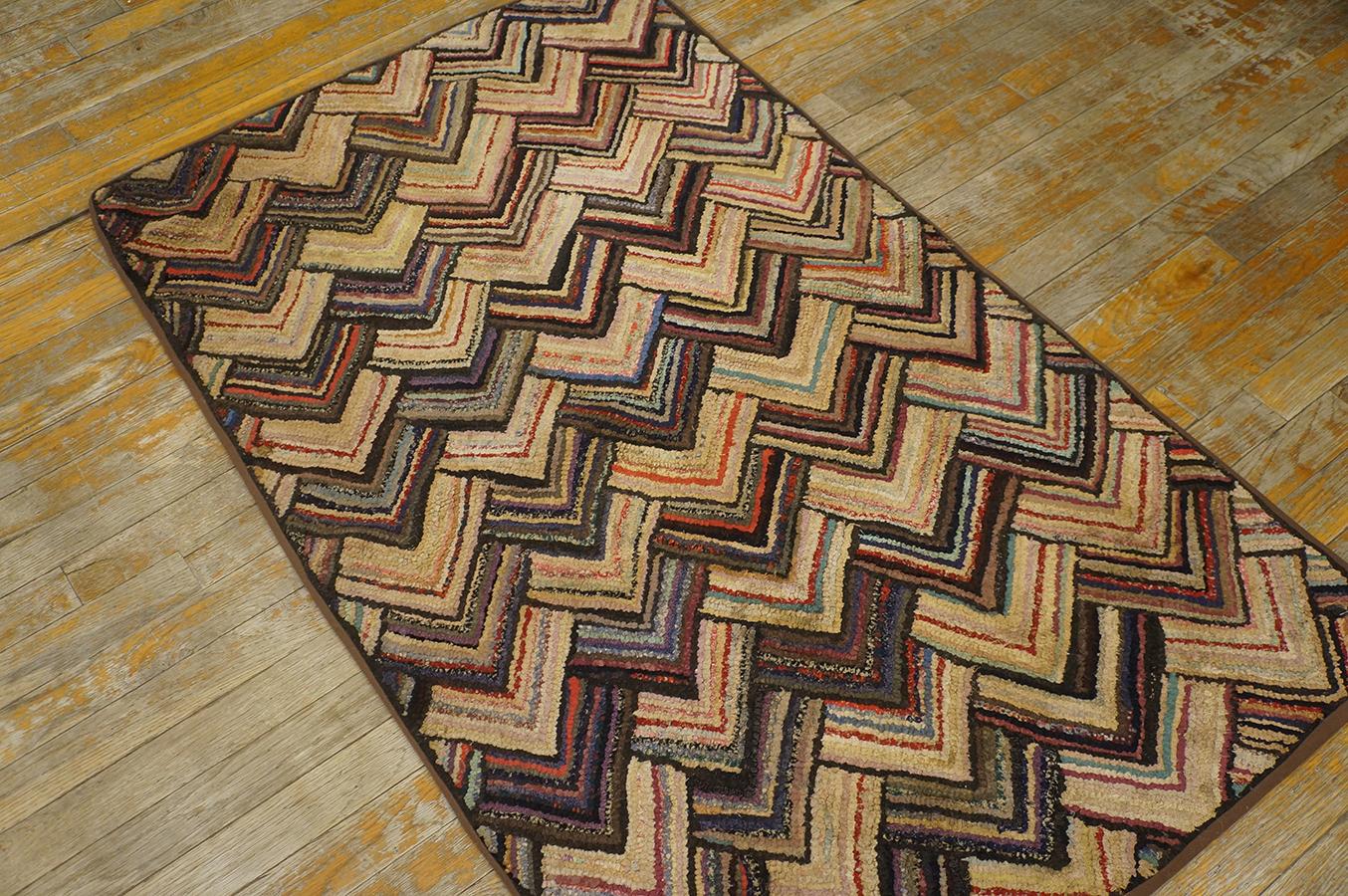 Antique hand-woven American Hooked rug. Multi color layering yet unique color pattern. Brown border. Well maintained circa 1920. Measured 2' 7'' x 4' 6''.