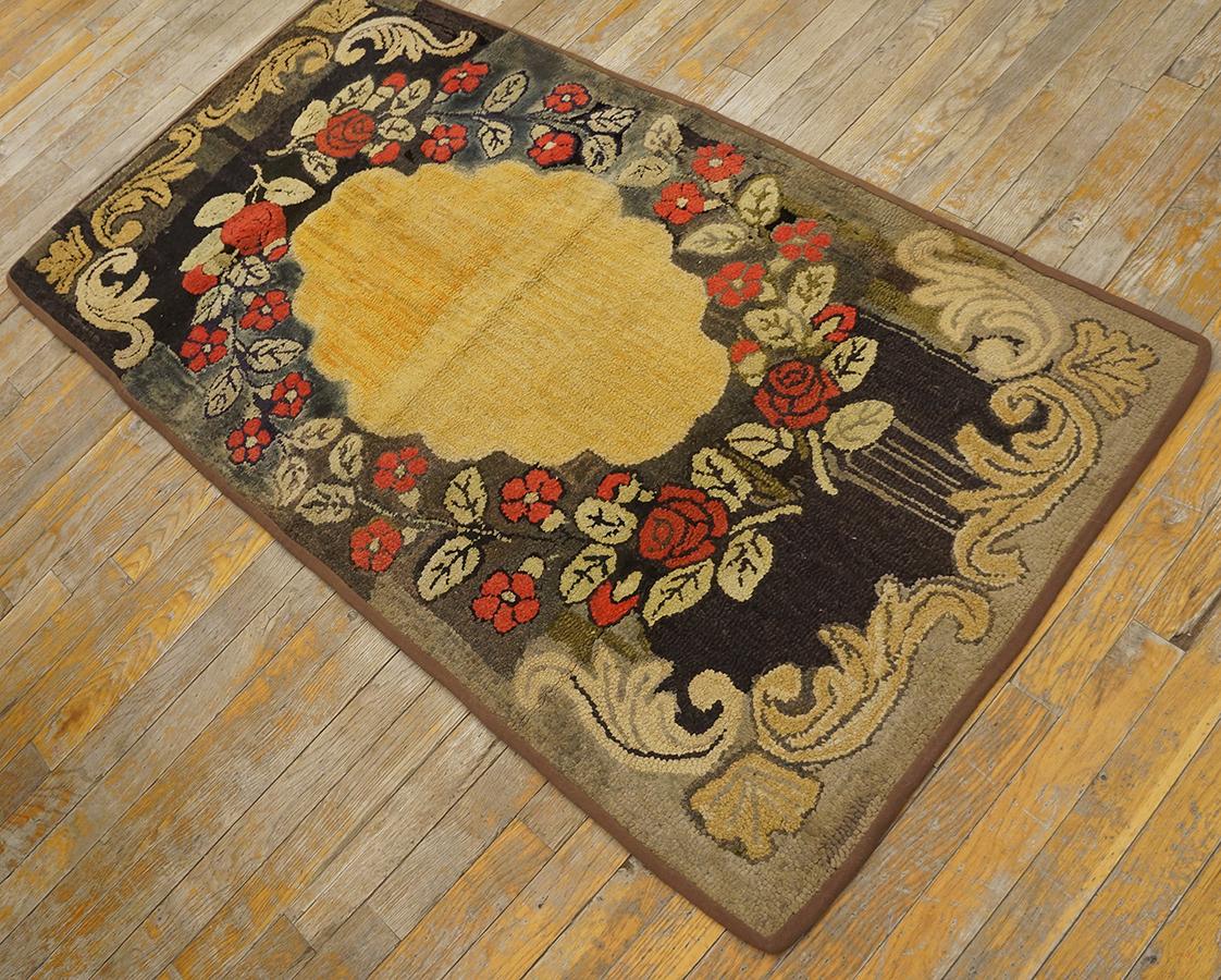 Antique hand-woven American hooked rug. Black and taupe tone base floral pattern brown border. Well maintained circa 1910. Measured 2' 8''x5' 0''.