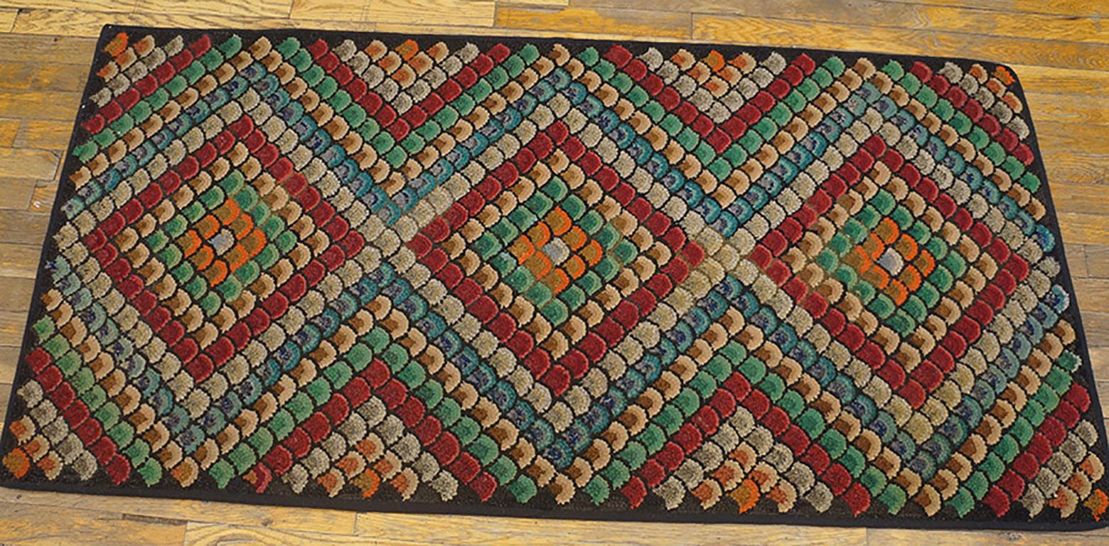 Antique American hooked rug. Size: 2'8