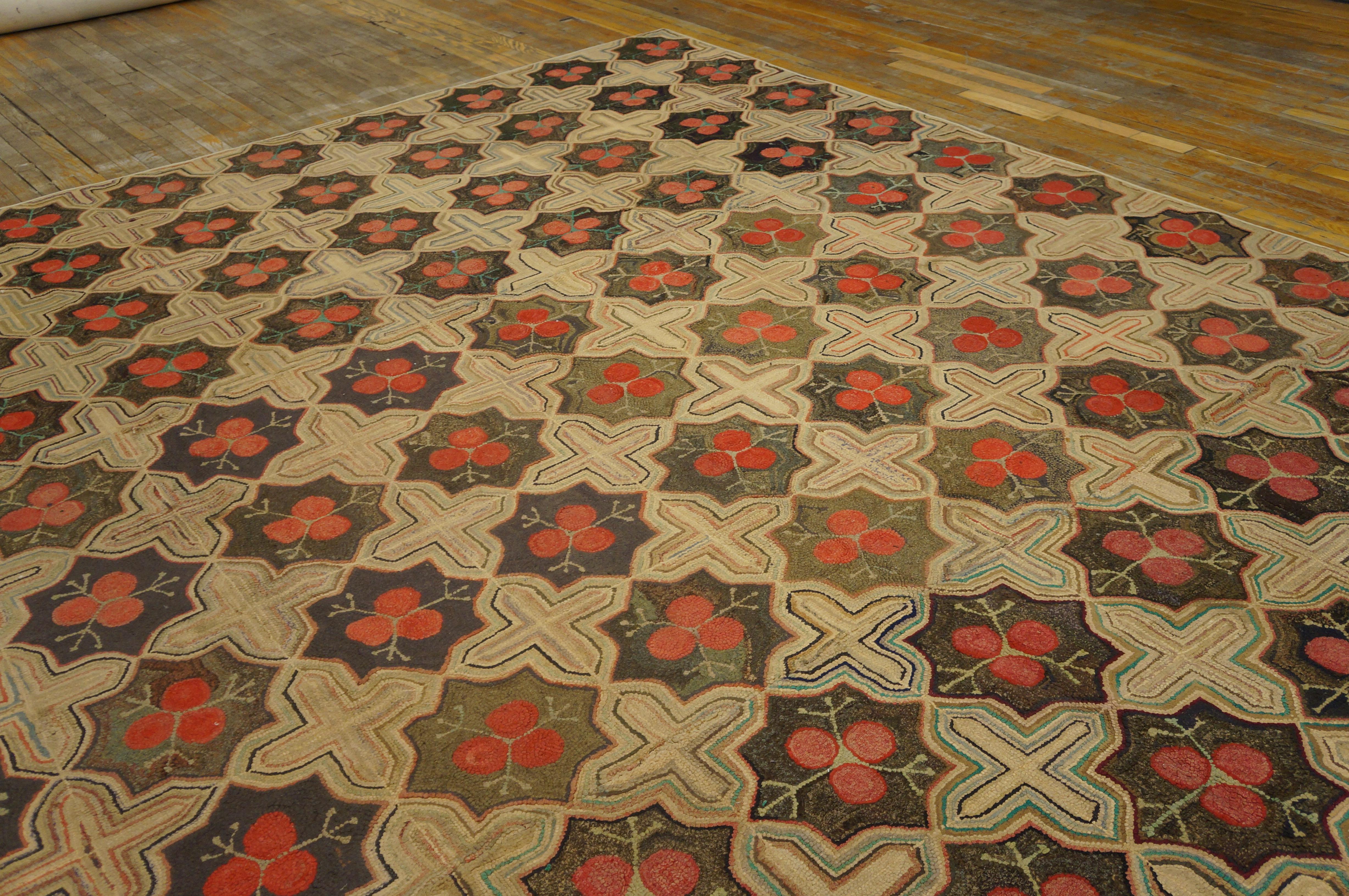 Antique American hooked rug. Measures: 9'6