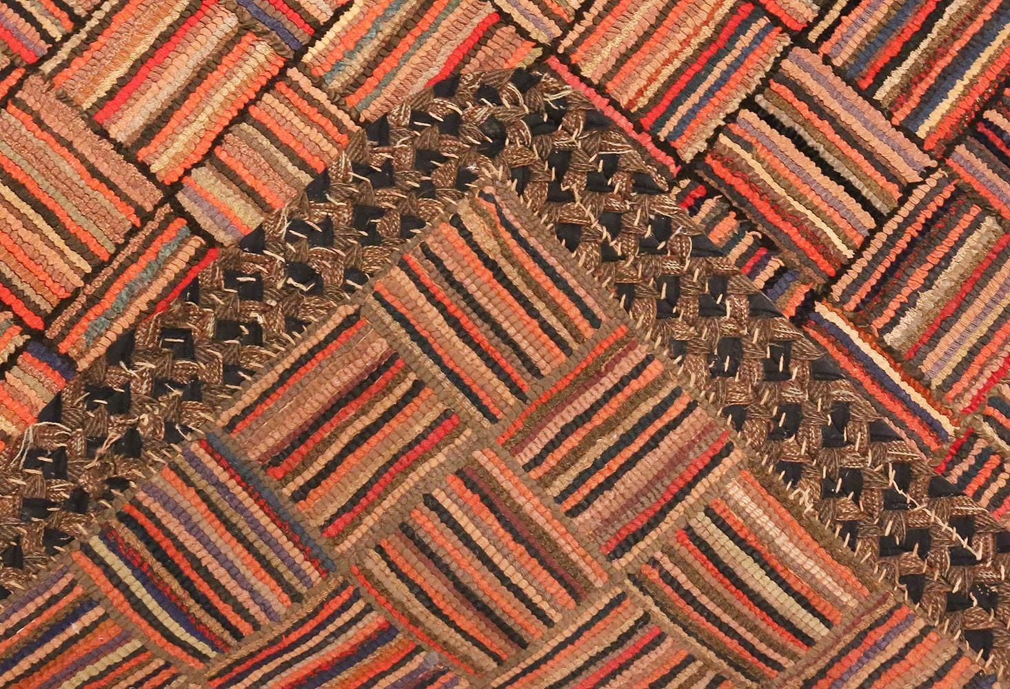 A beautiful Amish inspired antique basket weave pattern American hooked rug, country of origin / rugs type: antique American rugs, circa early 20th century.