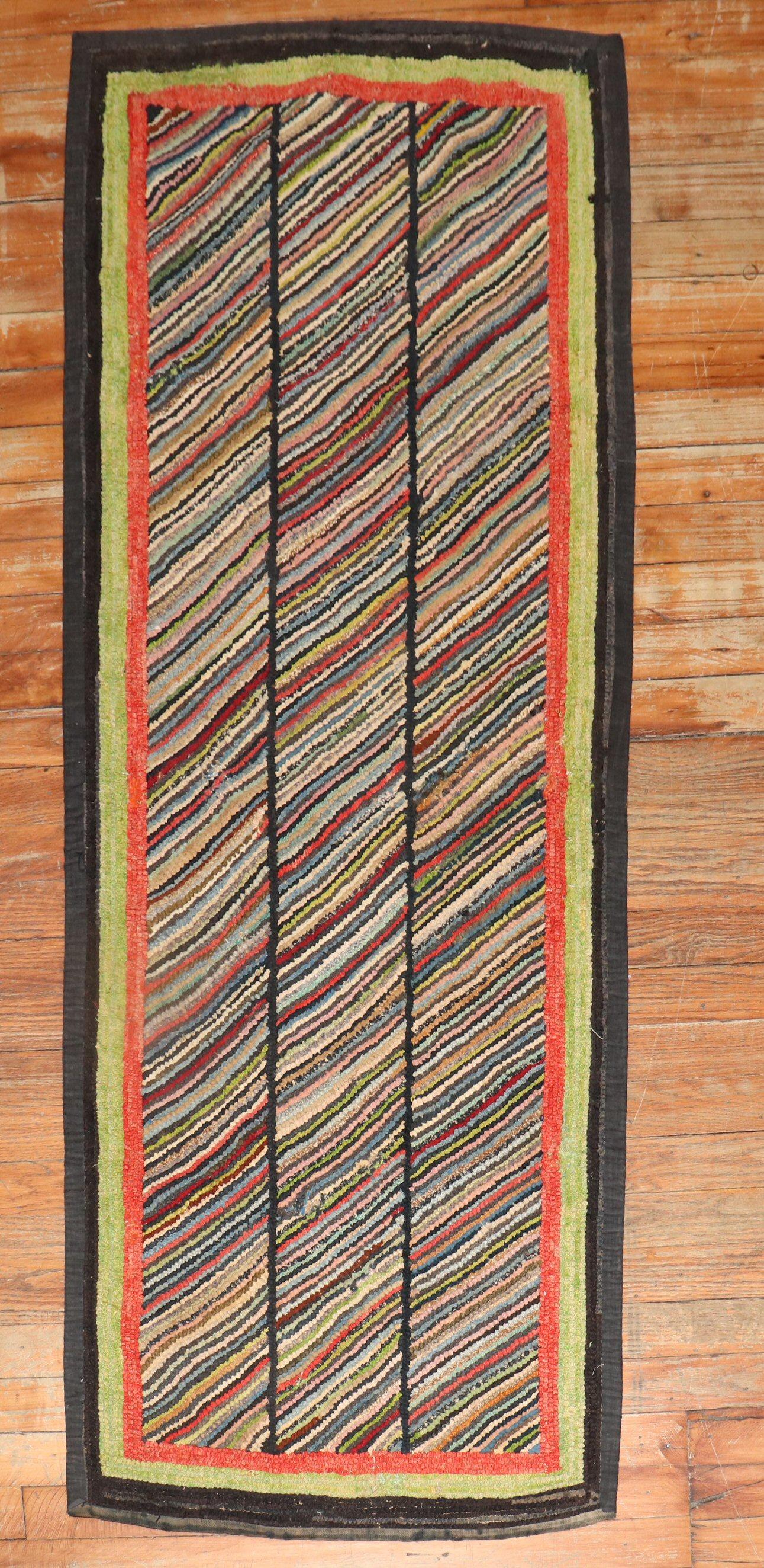 A handmade one-of-a-kind American hooked rug from the 2nd quarter of the 20th century. 

Measures: 2' x 5'1''.