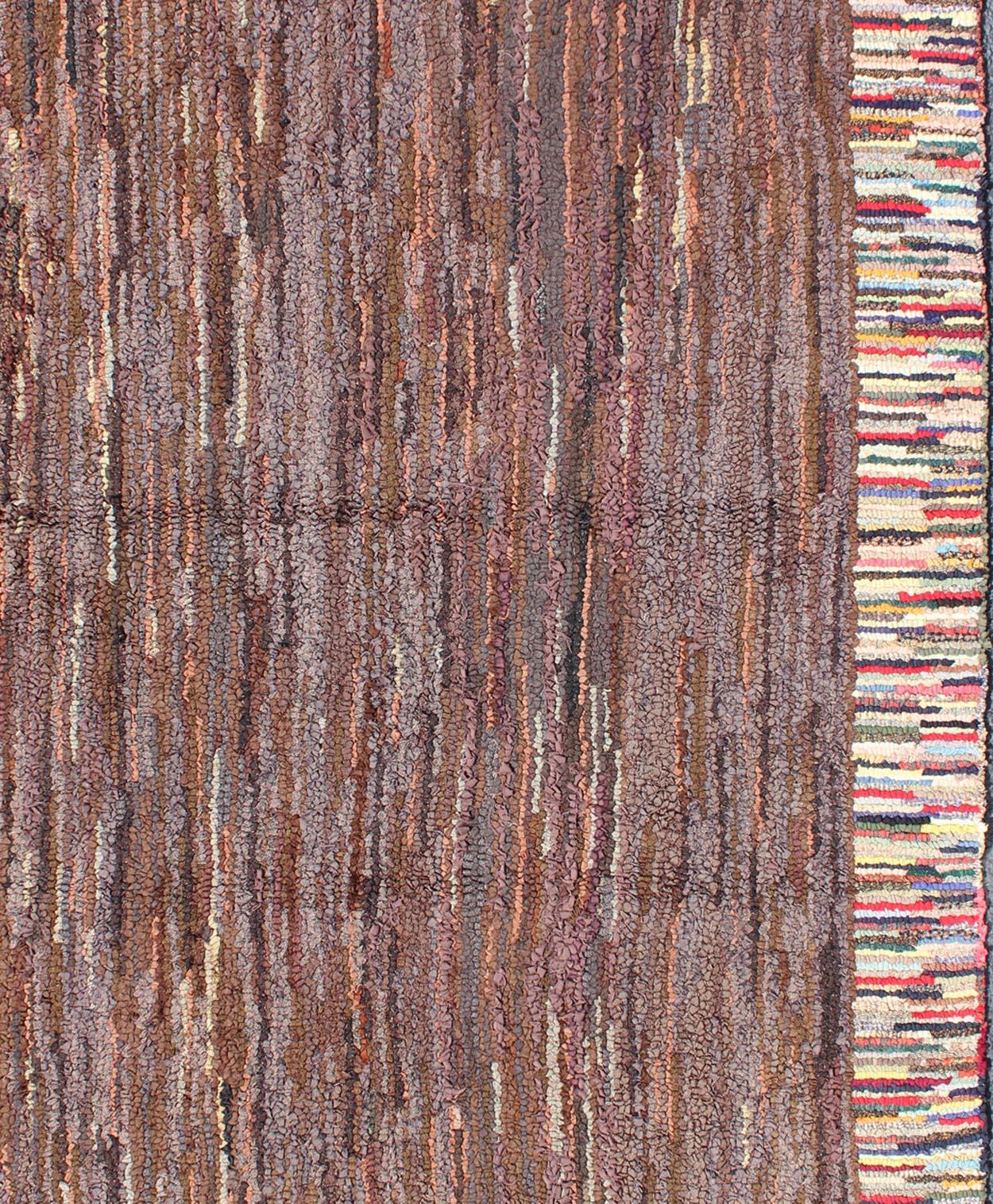Antique hooked rug with variegated design, rug J10-1005, country of origin / type: United States / Hooked, circa 1920.

This antique American Hooked rug features a variegated stripe design. The rug was woven in a hooked fashion, and the variety of