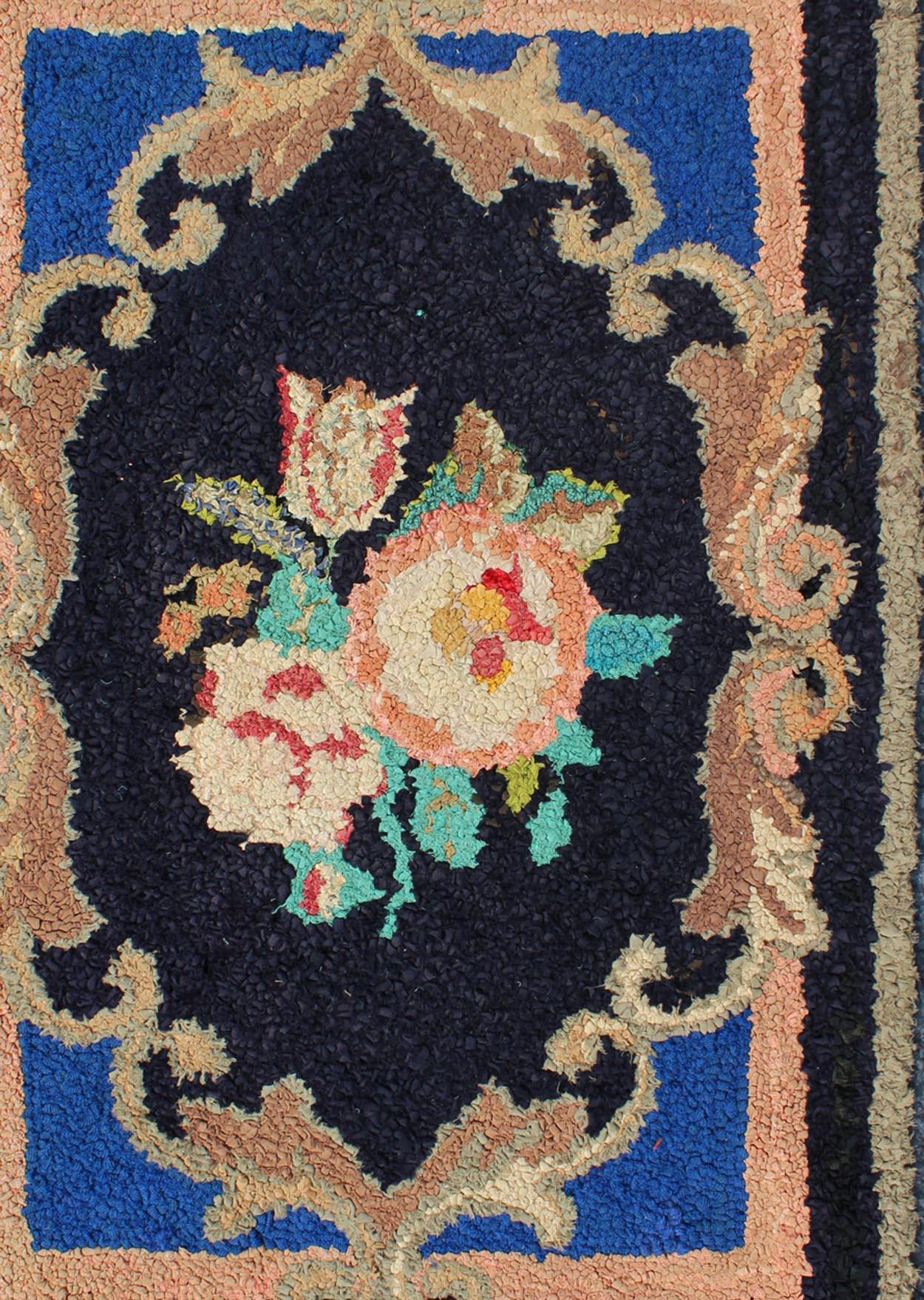 Antique American hooked rug in black background. This beautiful antique American Hook rug sets on black background with large floral medallion. Antique American hooked rug , rug S12-1205, country of origin / type: United States / Hooked, circa