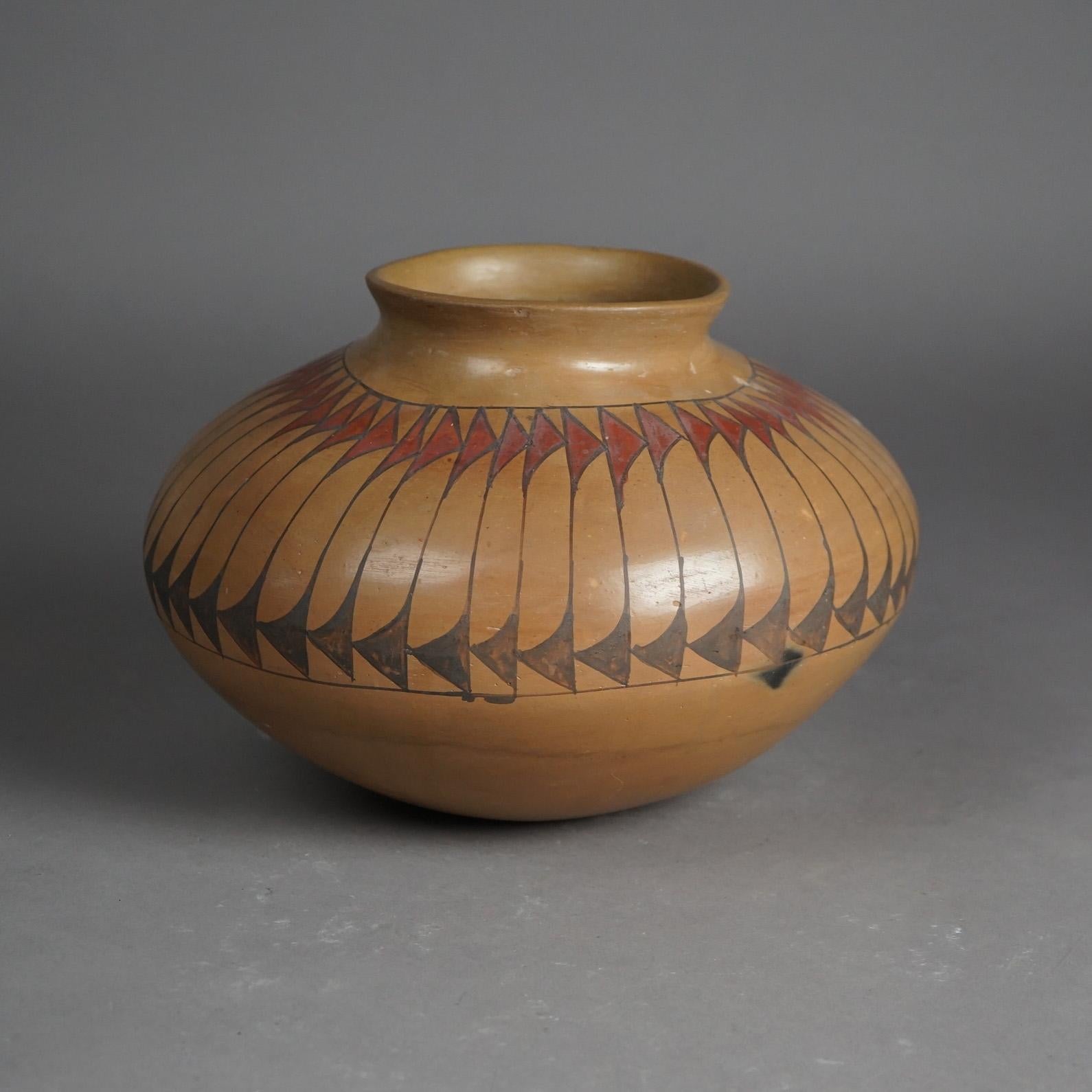 An antique Southwestern American Indian Taos Acoma olla offers pottery construction with stylized feather band, c1930

Measures - 7.75