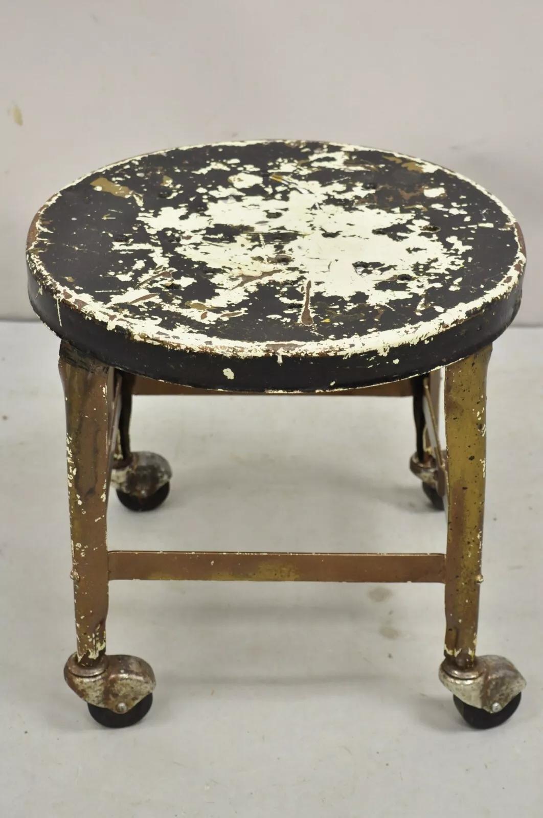 Antique American Industrial Distressed Painted Steel Metal Rolling Low Stool. Circa Mid 20th Century. Measurements: 14
