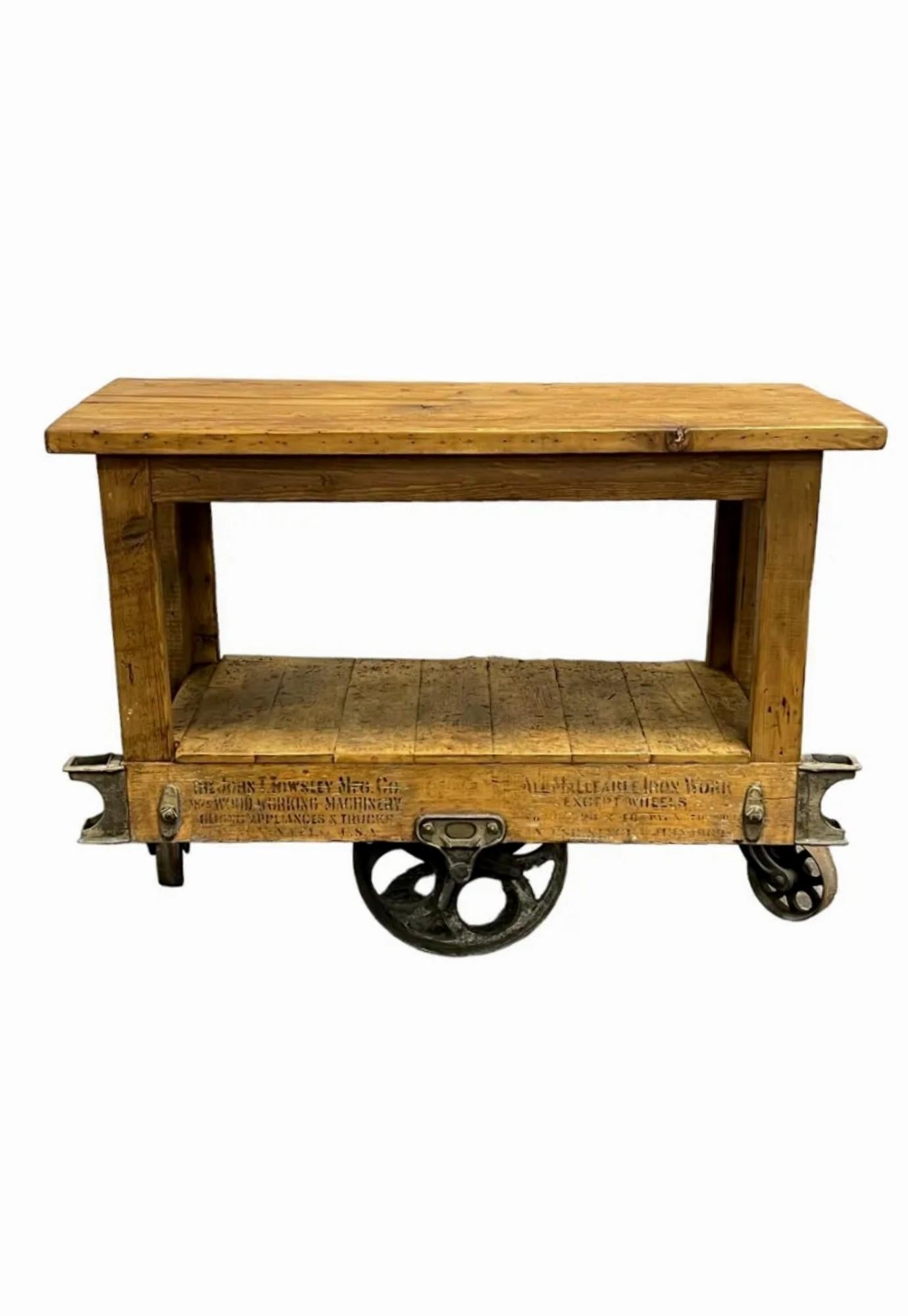 Antique American industrial warehouse work cart by The John T. Towsley Manufacturing Co. (1886-1930), Cincinnati, OH, U.S.A. 

Hand-crafted in the early 20th century, Ohio, United States, heavy-duty solid wood construction, boarded top and shelf,