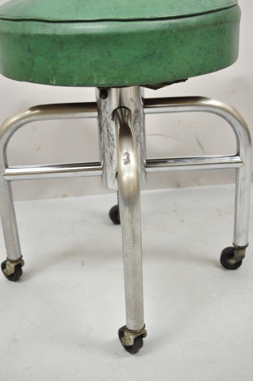 Antique American Industrial Metal Green Vinyl Rolling Work Stool Seat In Good Condition For Sale In Philadelphia, PA