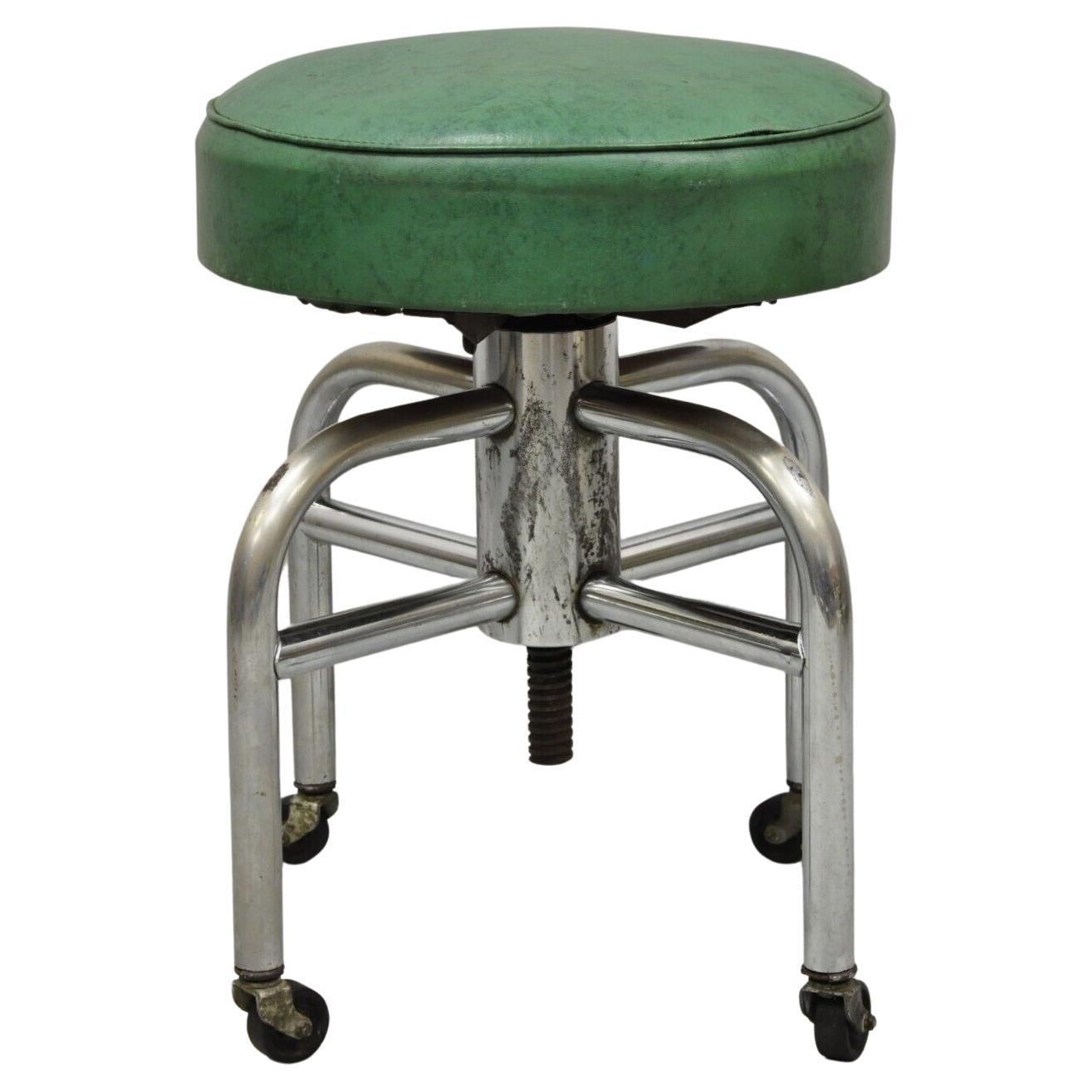 Ancien tabouret de travail industriel américain en métal vert et vinyle à rouleaux