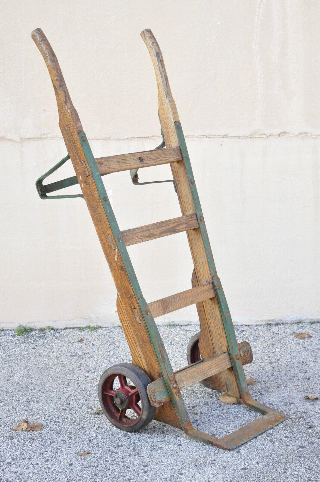 Antique American Industrial oak wood and metal hand cart hand truck dolly. Item features green painted metal frame, solid wood construction, beautiful wood grain, original stamp, quality American craftsmanship. Circa Mid 20th Century. Measurements: