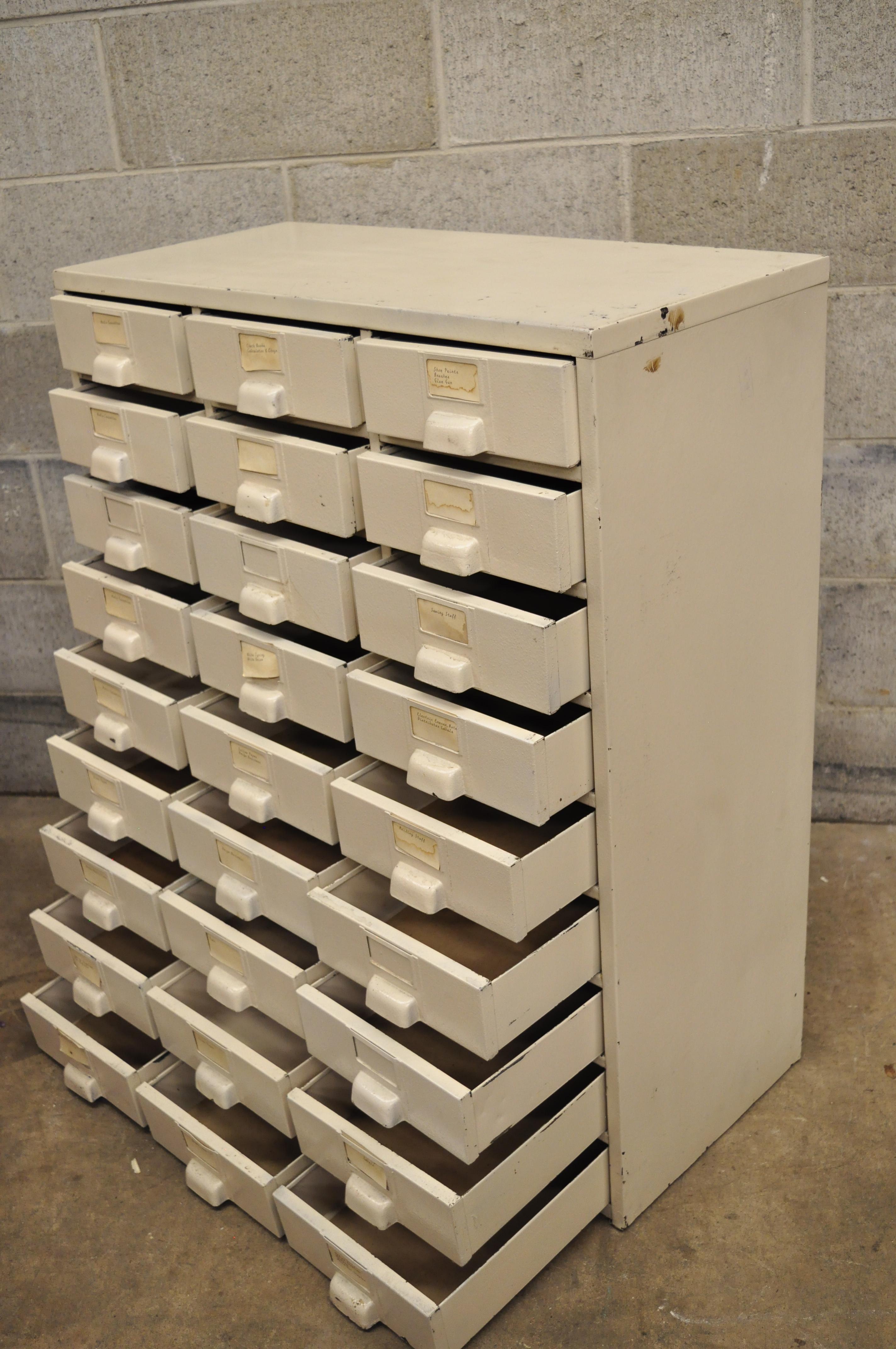 Antique American Industrial steel metal 27 drawer tool shop storage cabinet. Item features 27 drawers, steel metal construction, beige painted finish, very nice vintage item, quality American craftsmanship, circa mid-20th century. Measurements: 37