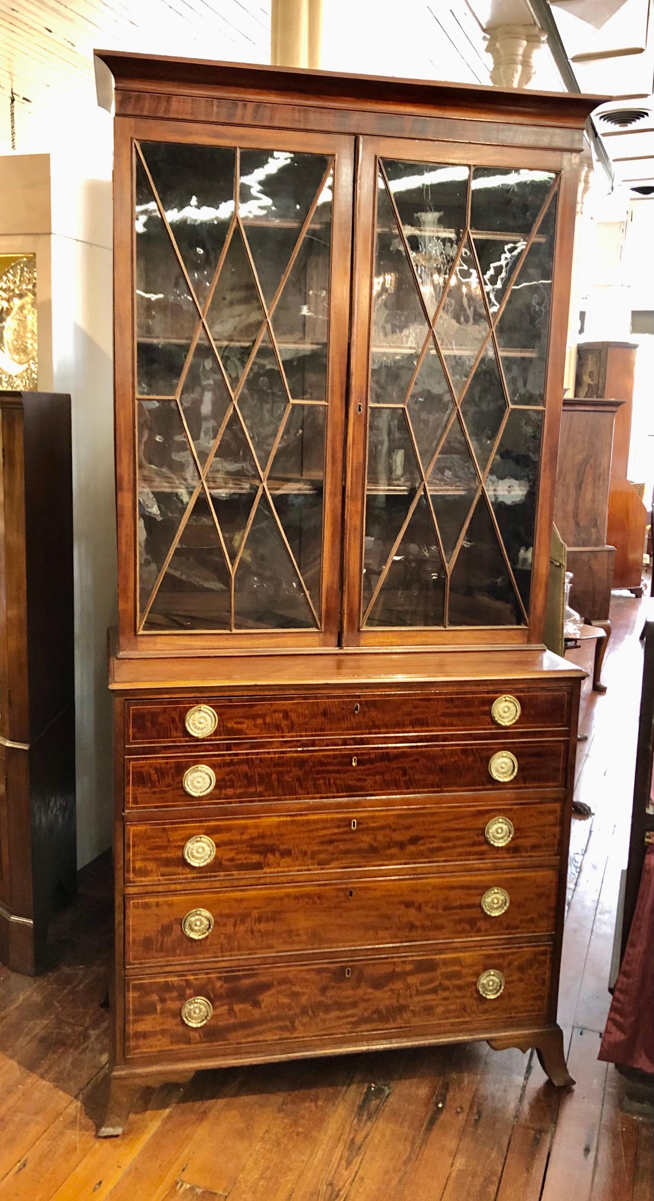 Wonderful Late Federal antique American (New York or Connecticut) finely figured Mahogany Secretaire Bookcase with glazed two-door upper section over a base having graduated drawers with the upper drawer opening to reveal a highly inlaid and fitted