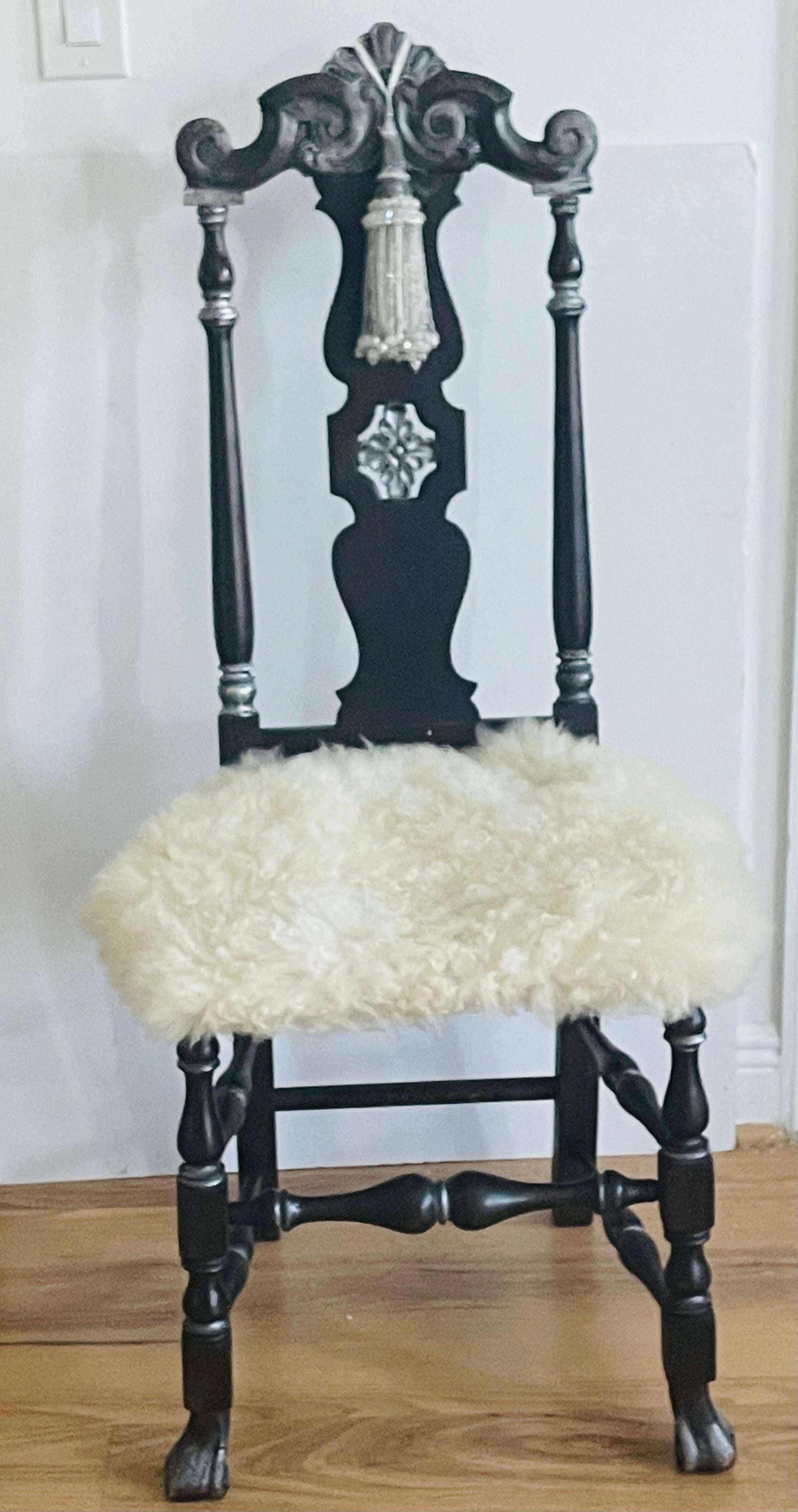 Antique American Jacobean chair, embellished with silver wash, Lambskin fur cushion, silver tassel.