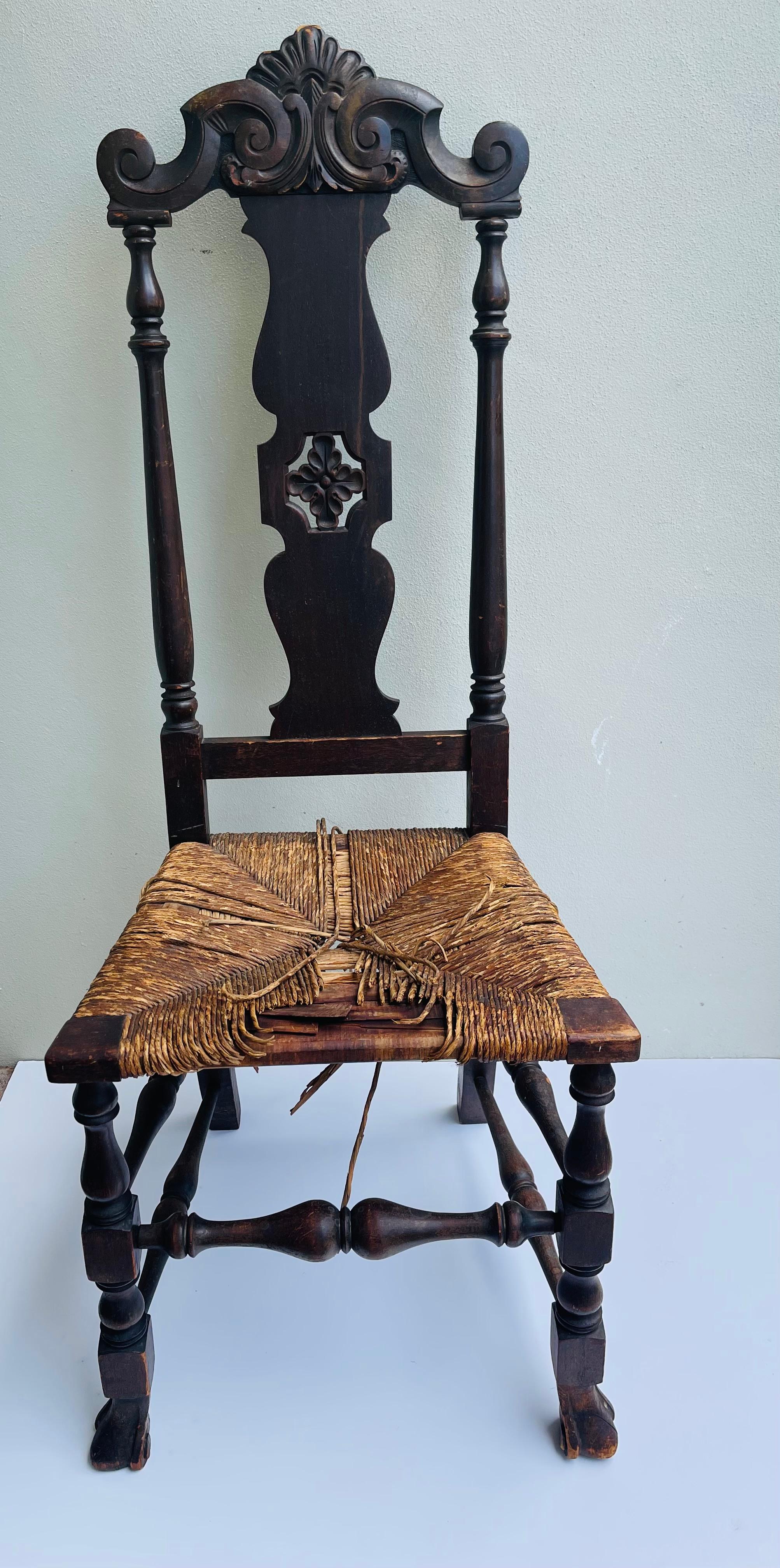 American Antique handcarved Jacobean chair with nice details.  Some Loss to the seating area, that can be easily restored or covered with cushion, adds character to the period piece.