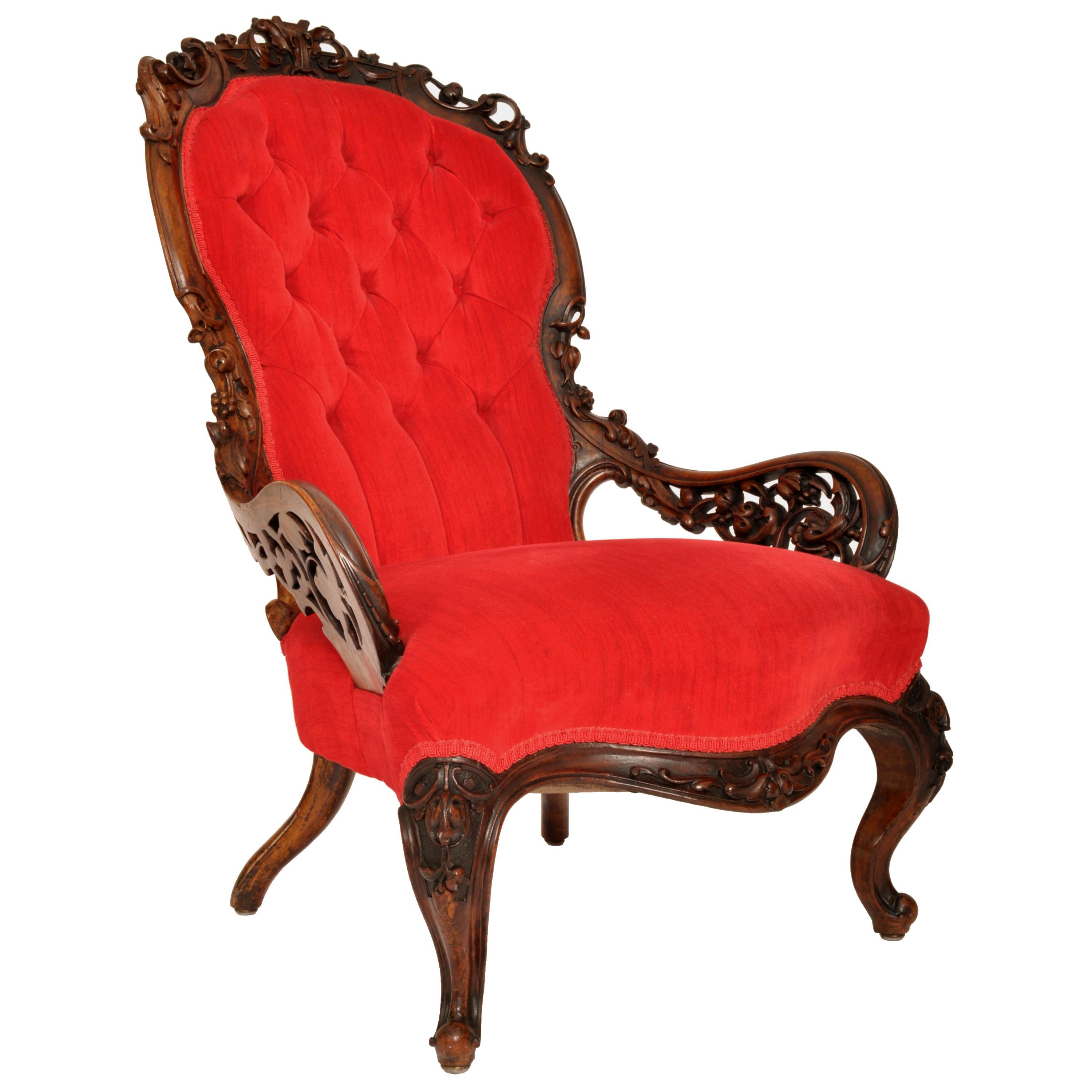 A good antique American mid 19th century carved Rococco rosewood armchair, by John Henry Belter or Joseph Meeks, New York, 1850's.
The chair having a carved & pierced scrolling top, with a deep buttoned/tufted back rest, the chair having