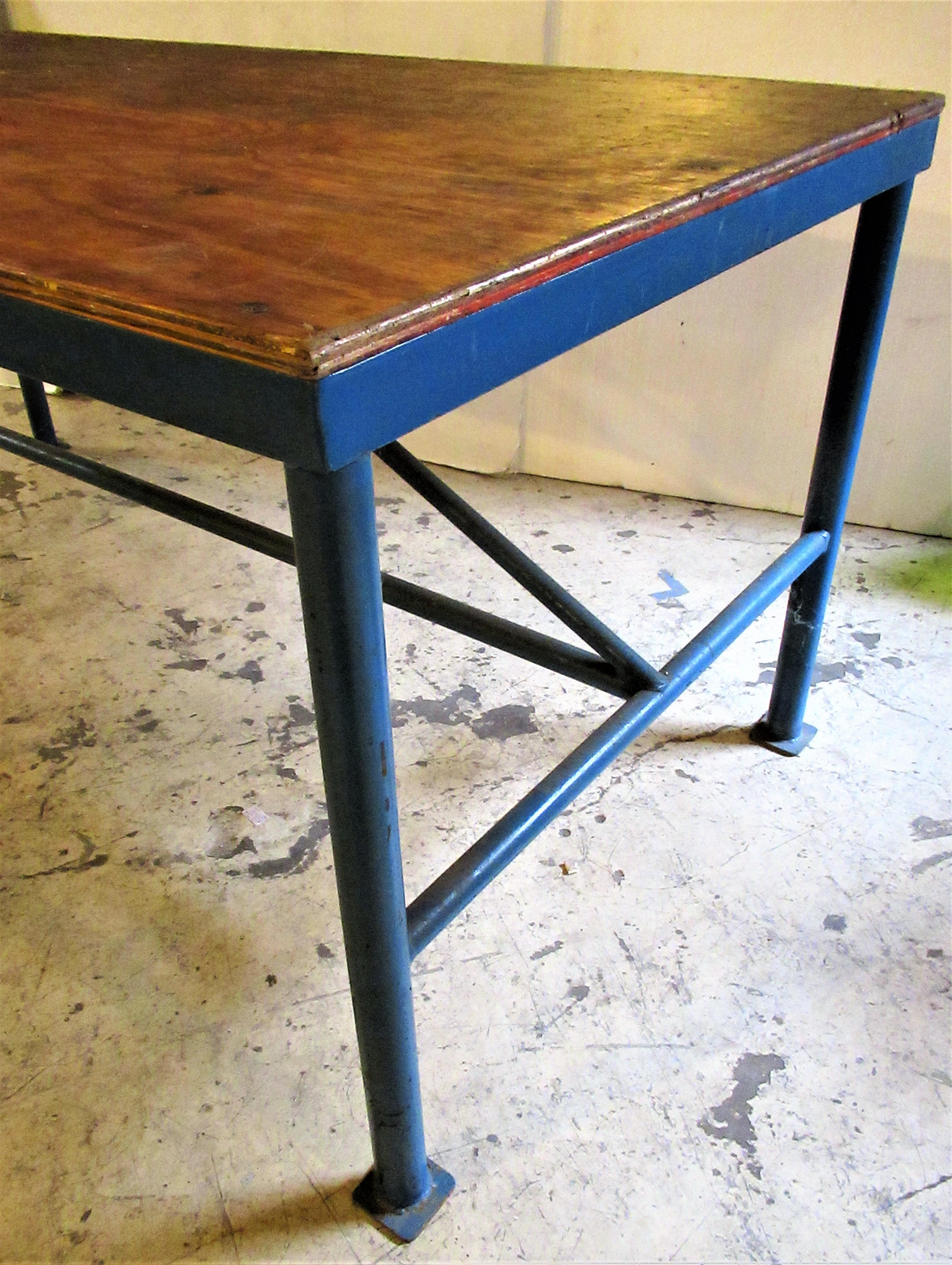  All original American industrial factory work table with beautifully aged rich blue painted    
  architectural iron base and thick plywood top. Circa 1930-1940. This is a good one. Look at all pictures and read condition report in comment section.