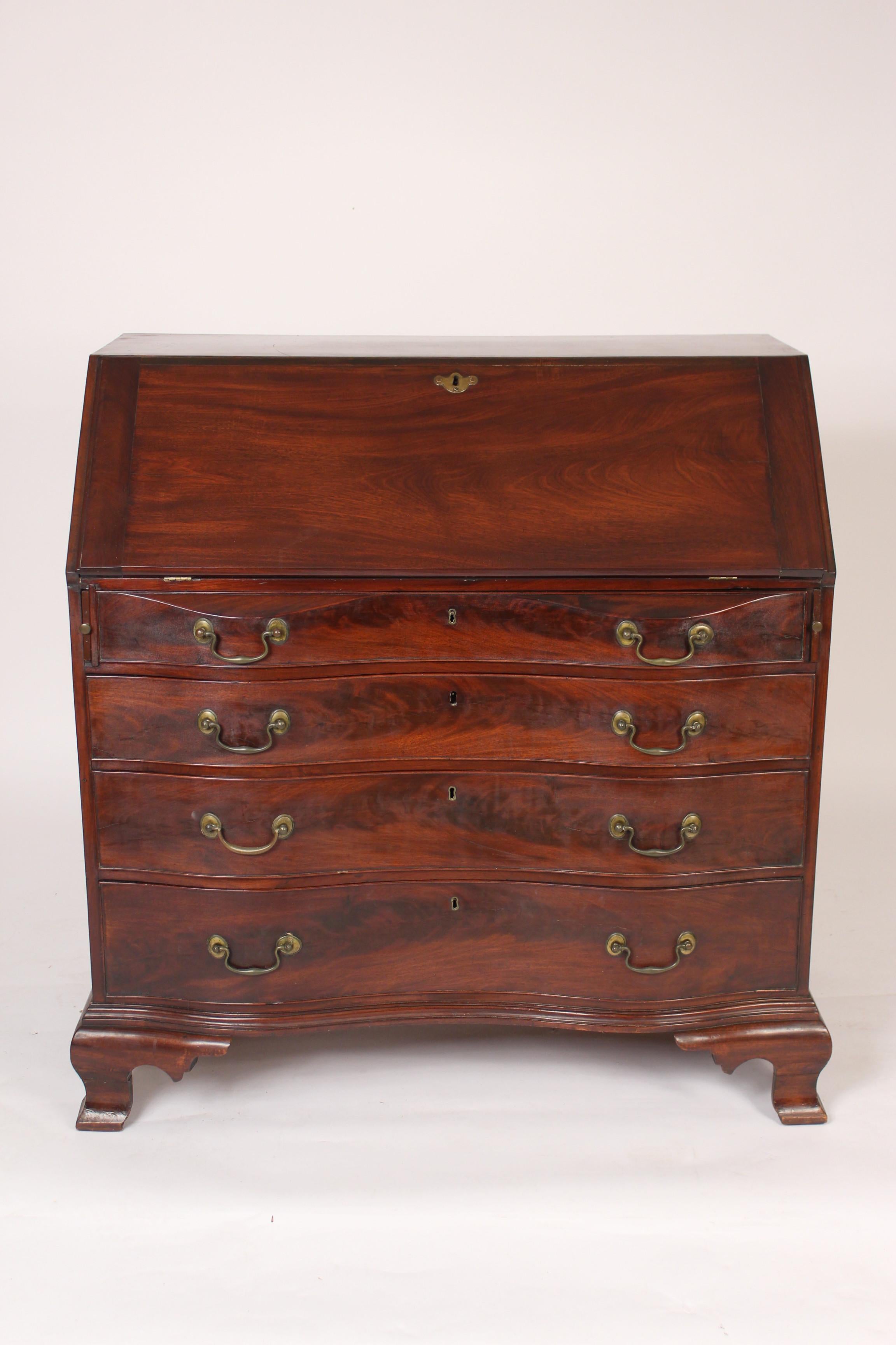 Antique American mahogany oxbow front slant top desk, 19th century.