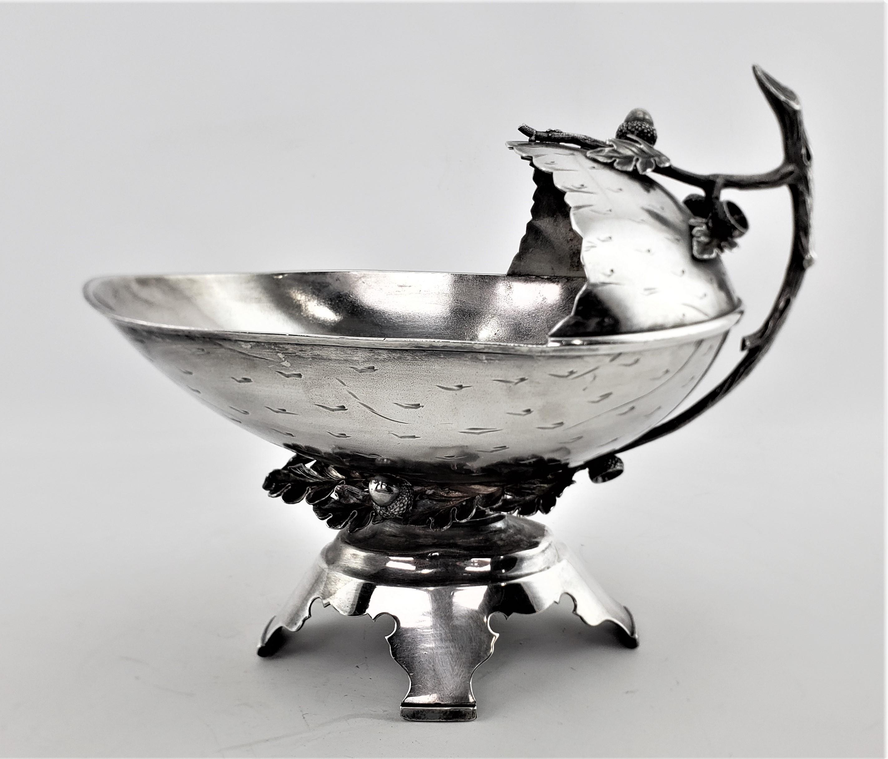 This large antique silver plated figural centerpiece was made by the Middletown Plate Company of the United States in approximately 1900 in a period Art Nouveau style. This figural centerpiece is done in a very realistic manner depicting a large