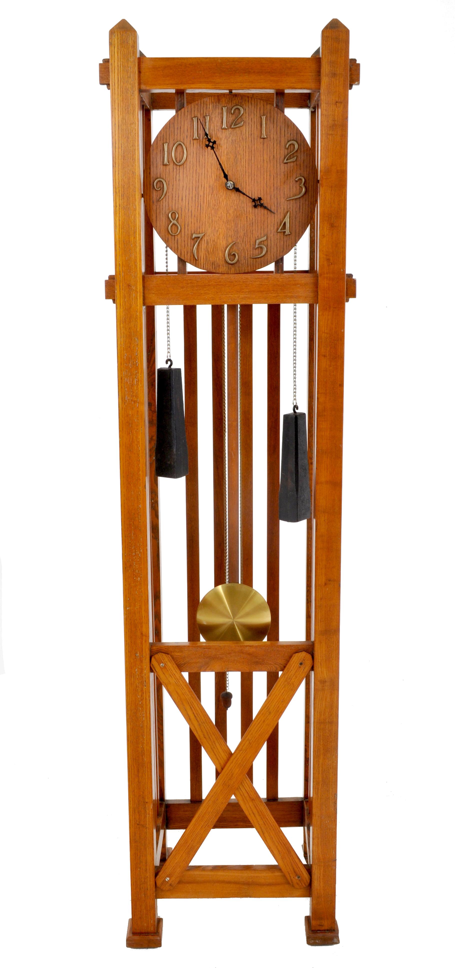 Antique American Mission Arts & Crafts oak 8-day grandfather tall case clock, circa 1900. The clock made from solid oak and having through mortis and tenon construction, the dial having brass Arabic numerals. The clock having iron tapered weights