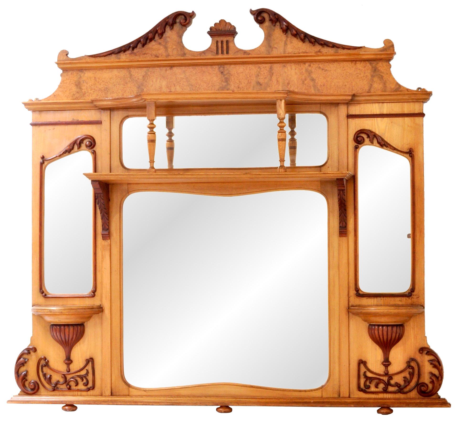 A substantial antique American walnut and ash overmantel mirror, circa 1870. The mirror of neoclassical form and having a swan's neck pediment to the top with applied carvings. Below are two shelves supported by turned supports, the center having