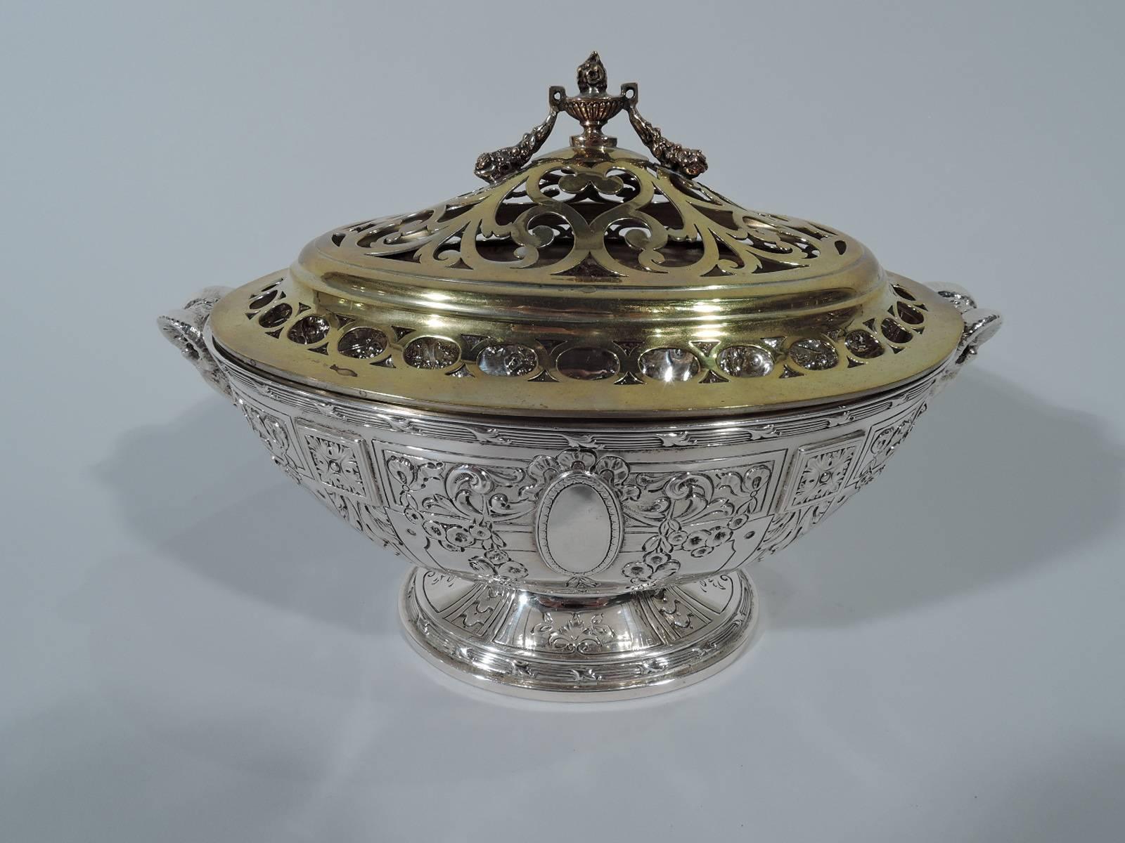 Edwardian neoclassical sterling silver flower bowl. Made by Galt & Bro., Inc. in Washington DC. Tureen-form with oval bowl and raised foot. Chased and engraved Adams-style ornament with pilasters, garlands, ribbon, and oval medallions (vacant).