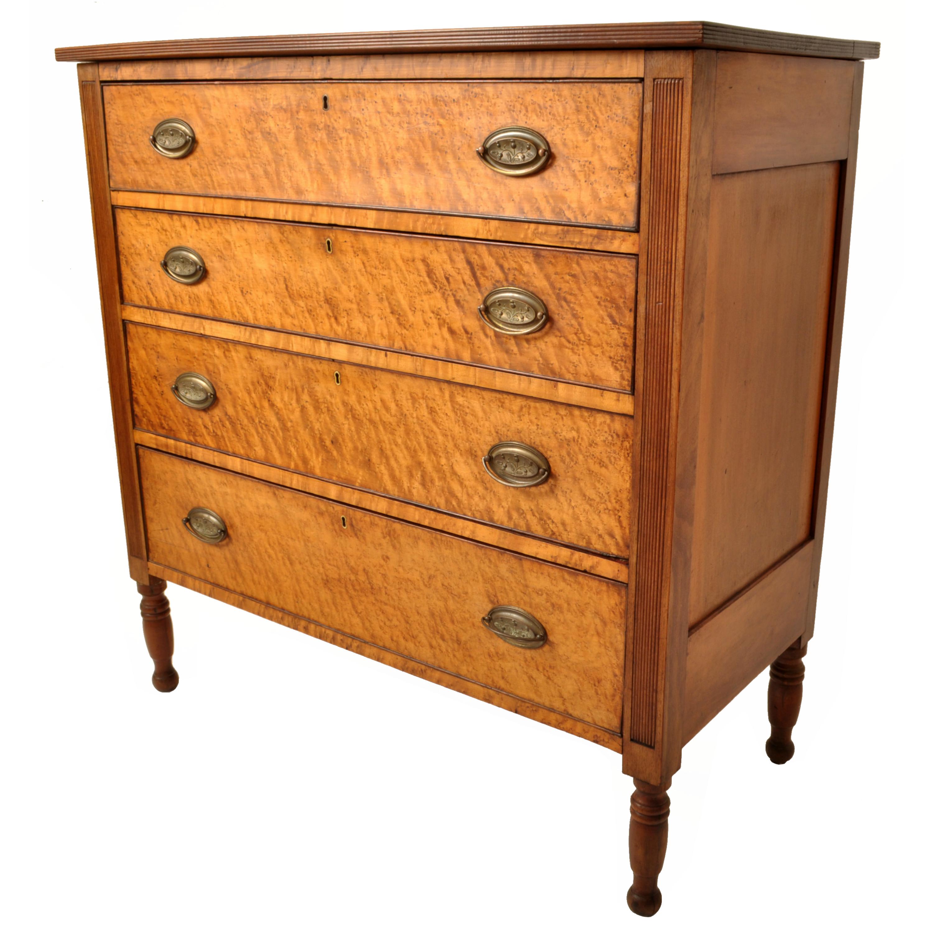 A good antique American New England Federal period 'Tiger' maple and cherry chest of four drawers/dresser in the Sheraton style, Vermont, circa 1825.
The four drawer chest with a cherry carcass and 'Tiger' maple drawer fronts, the chest having a