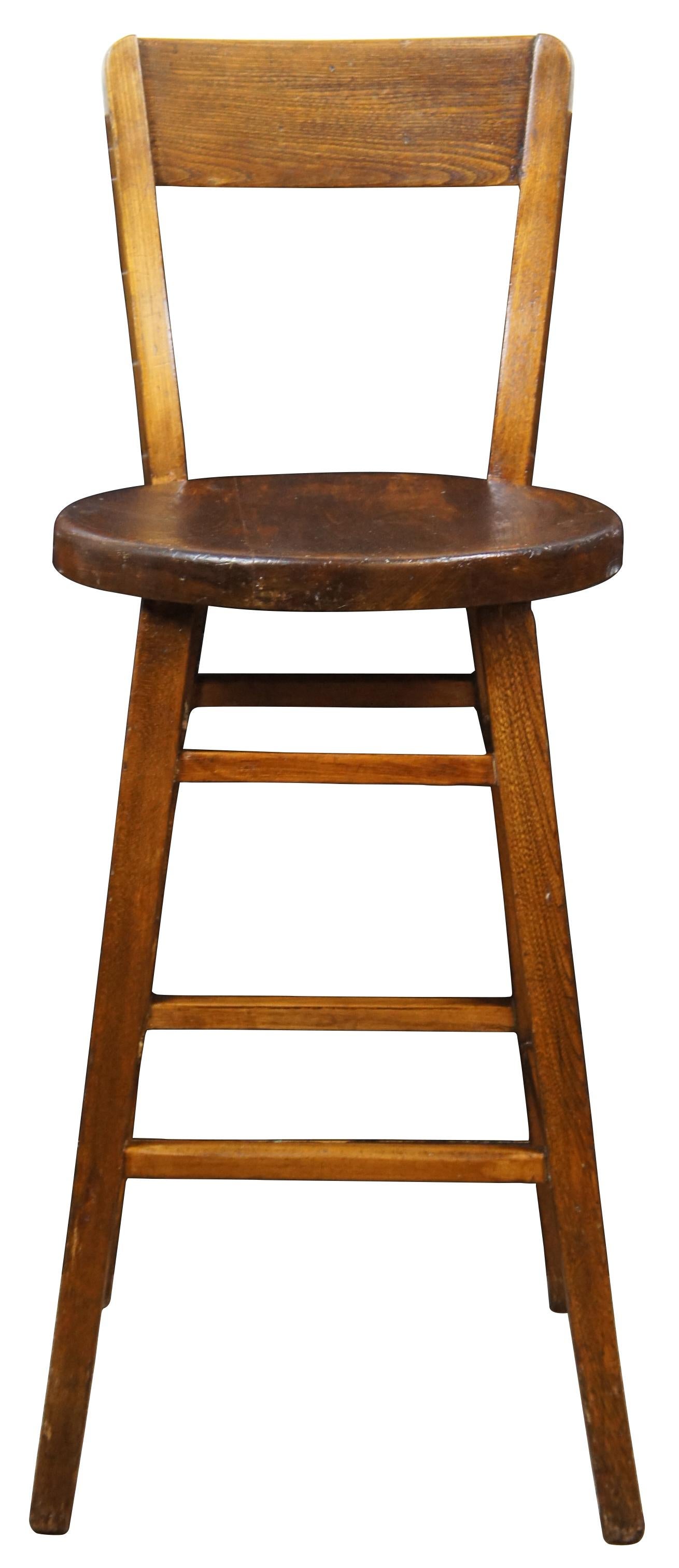 Antique country style oak counter or bar stool. Marked Rec Ins along the back of seat. Measure: 36