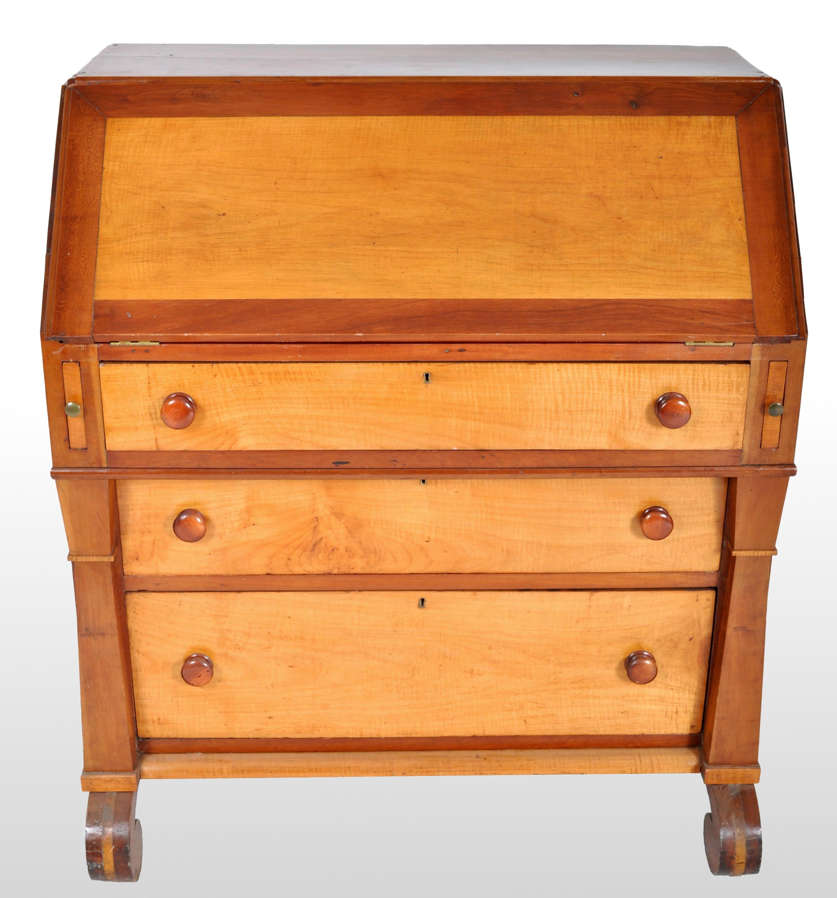 Antique American pre-civil war maple bureau/desk, circa 1830. Made from curly maple, the fall-front enclosing a fitted interior with eight drawers seven pigeon holes. Below are three graduated drawers and standing on scrolled feet.
