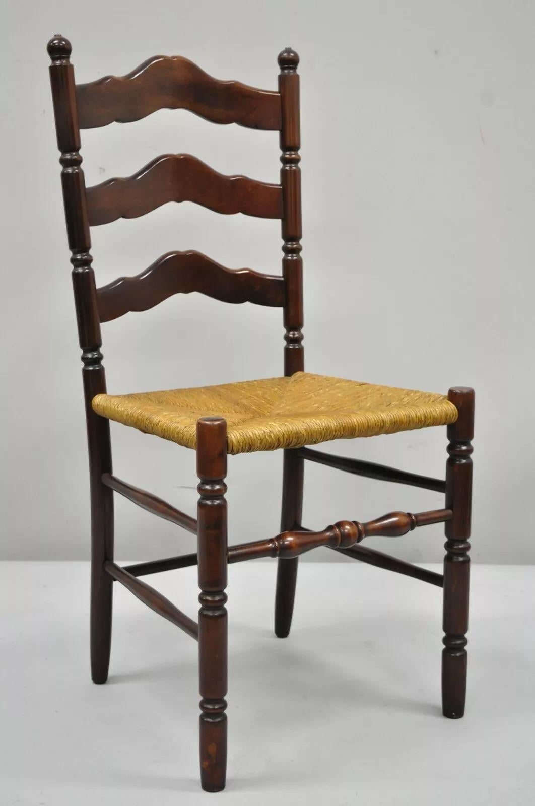 Antique American Primitive Cherry Wood Woven Rush Seat & Ladder Back Side Chair. Item features woven rush seat, ladder back, solid wood construction, beautiful wood grain, very nice antique item, quality American craftsmanship. Circa Early 1900s.
