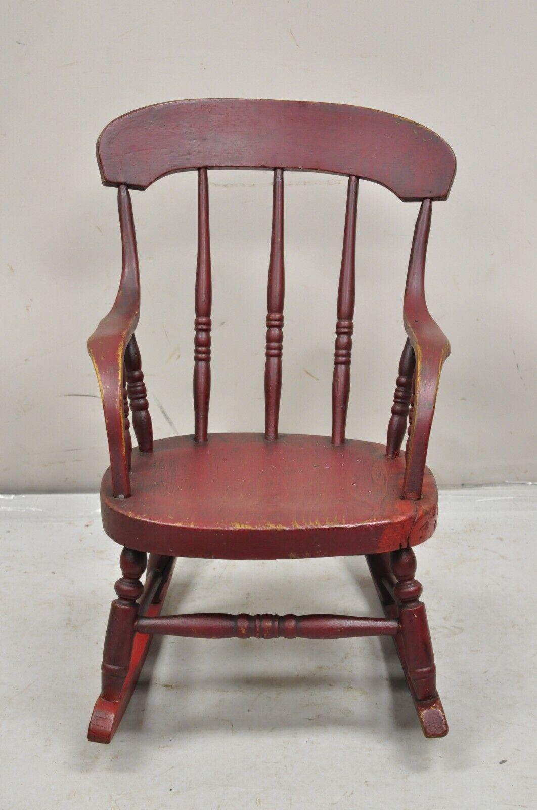 Antique American Red Painted Primitive Spindle Back Small Child's Rocker Rocking Chair. Circa 19th Century. Measurements: 21